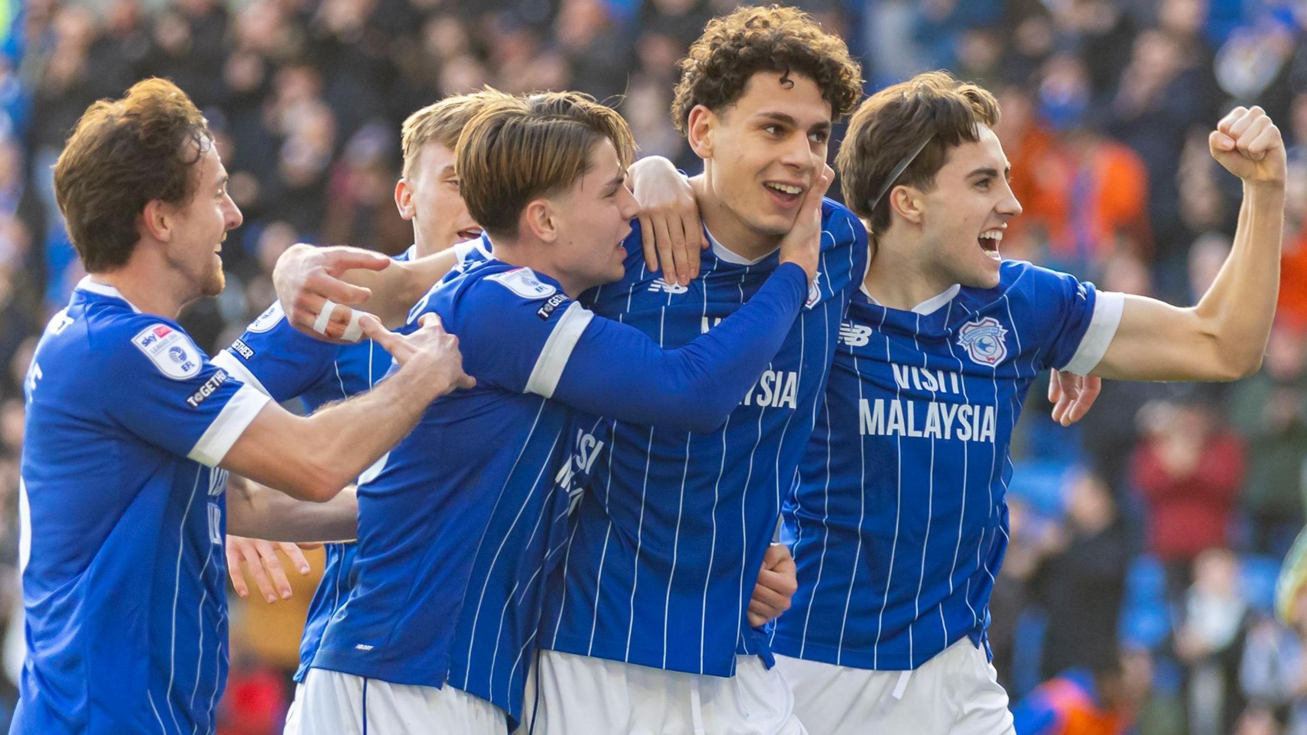 Cardiff striker Yousef Salech celebrates with his team-mates after scoring in the 3-2 win over Huddersfield
