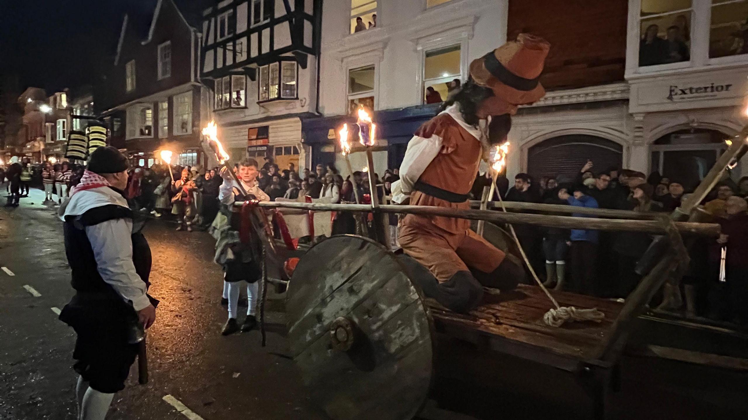 A Guy Fawkes effigy being carried through Lewes