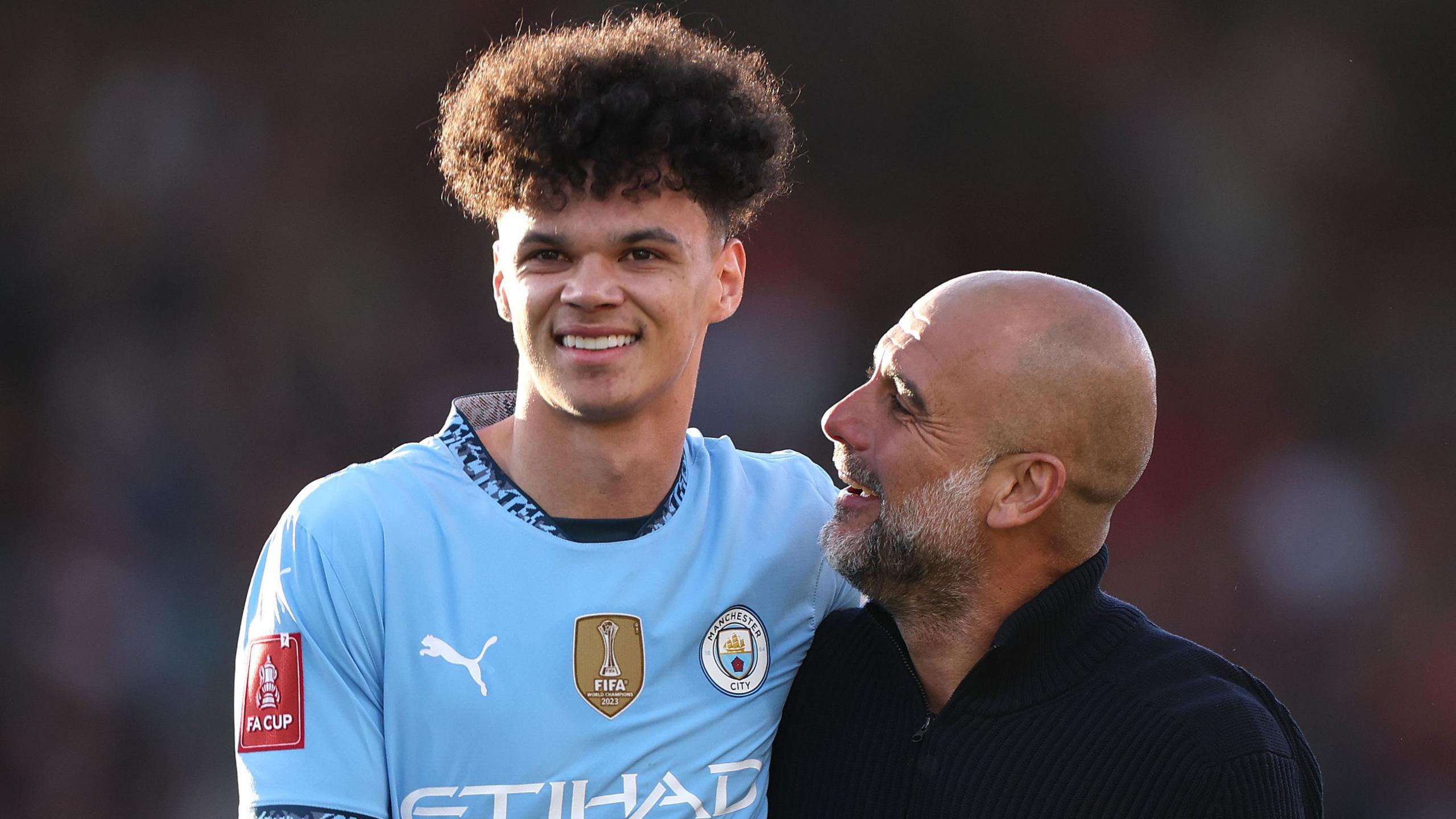Nico O'Reilly and Pep Guardiola