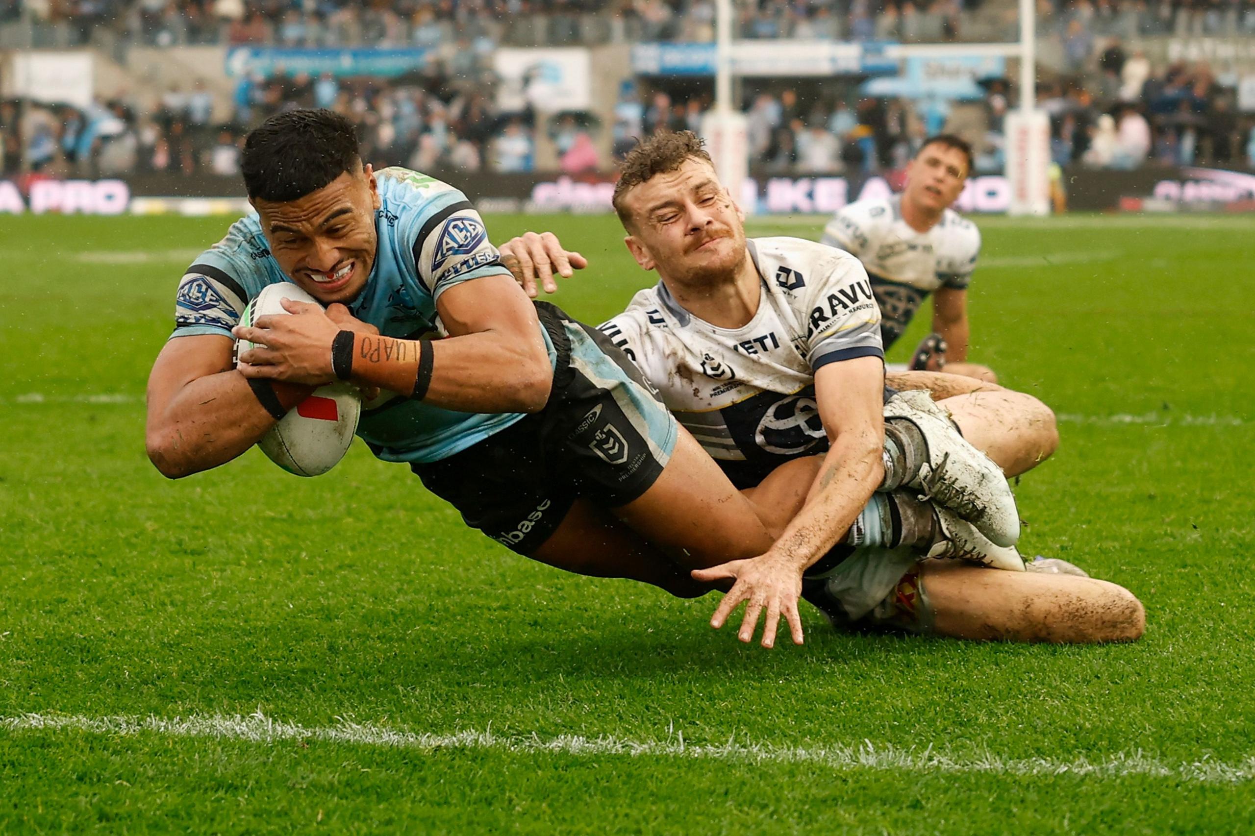 The Sharks' Ronaldo Mulitalo scores a try during the round 22 NRL match between Cronulla Sharks and North Queensland Cowboys at Shark Park in Sydney, Australia. Photo by Darrian Traynor
