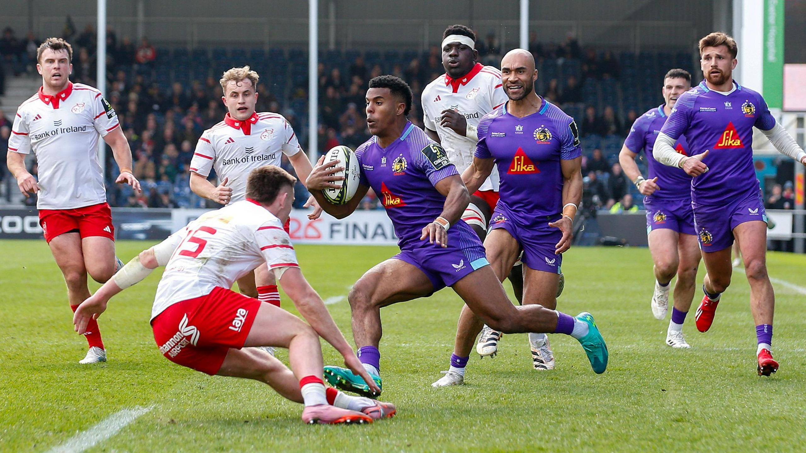 Immanuel Feyi-Waboso jinks his way through the Munster defence to score Exeter's fourth try