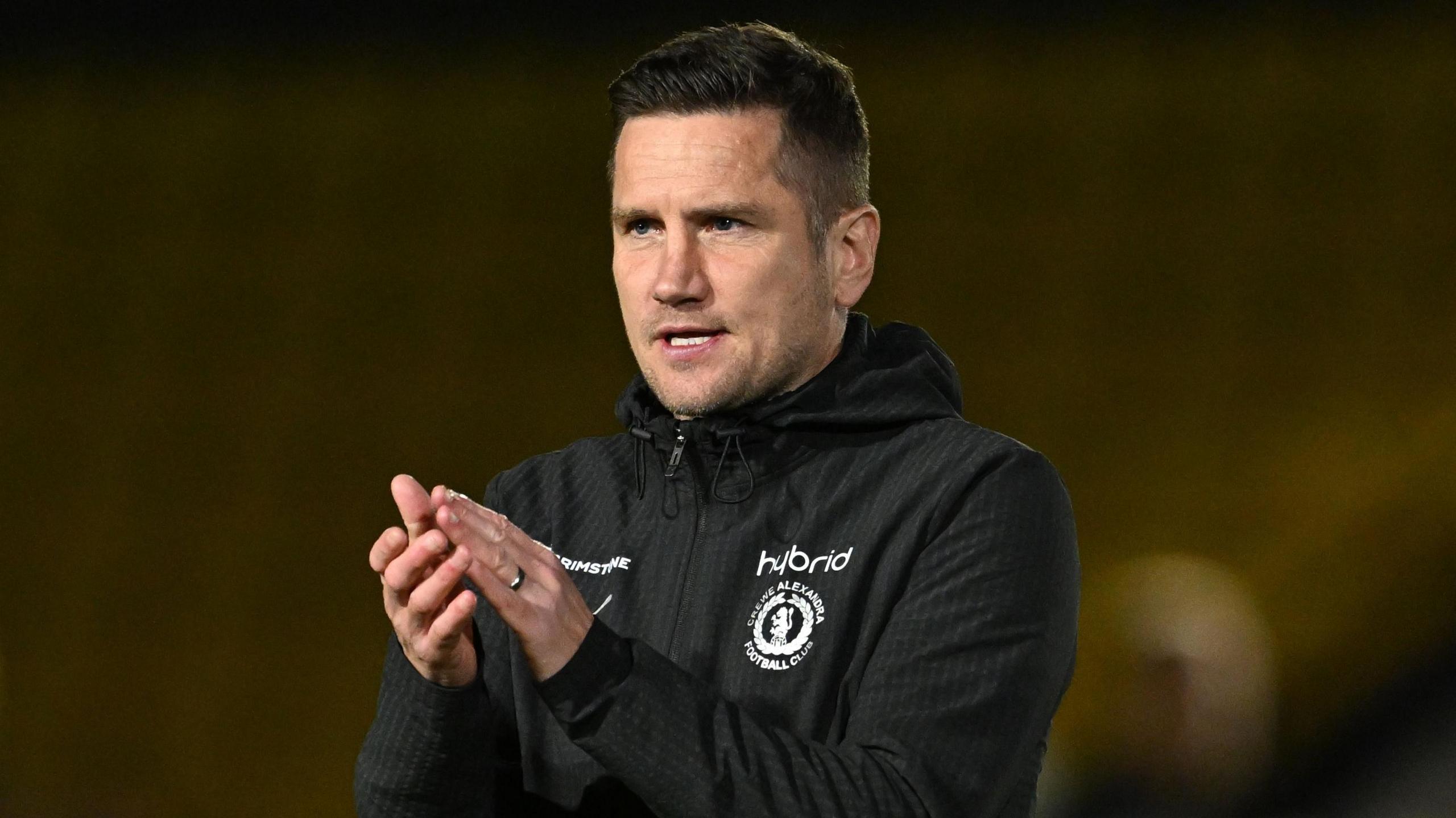 Lee Bell claps the crowd after a game