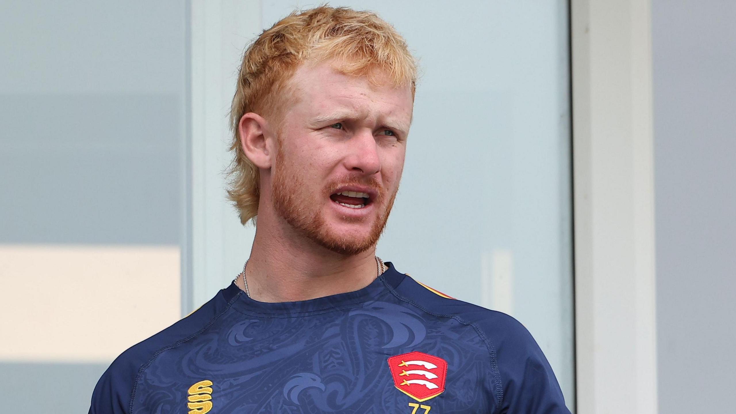 Jordan Cox on the balcony outside the Essex dressing room