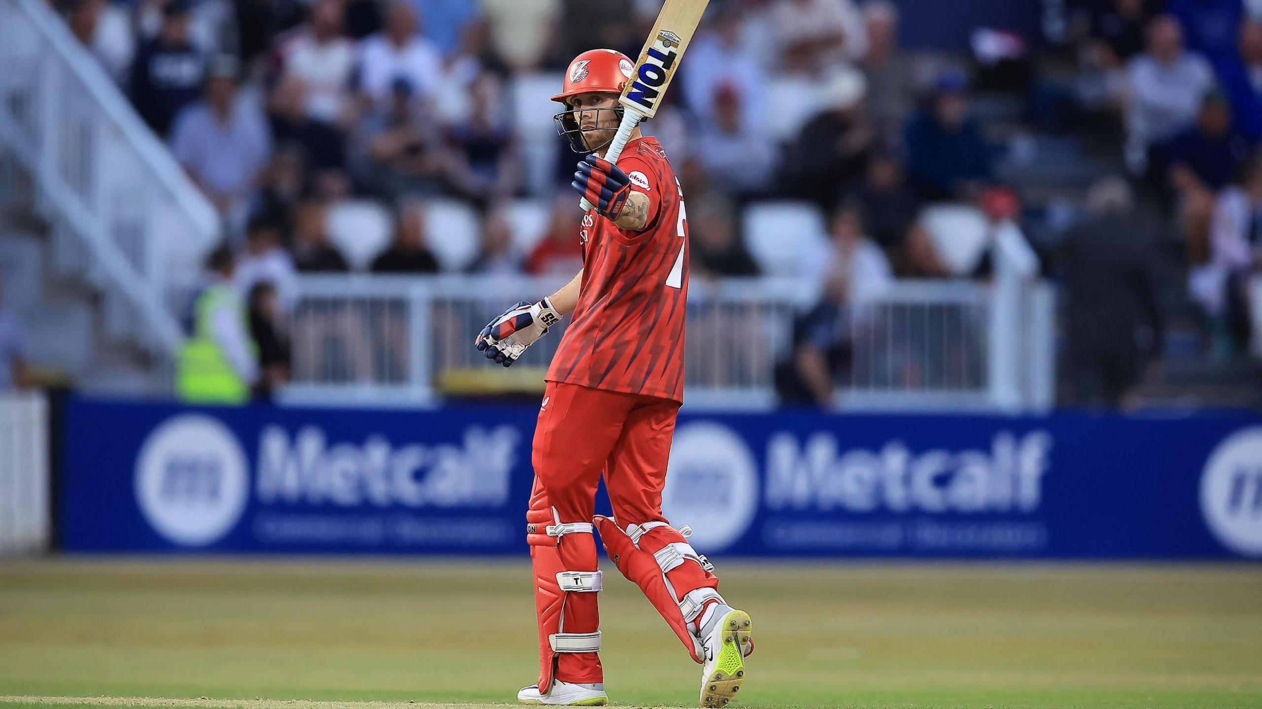Phil Salt raises his bat