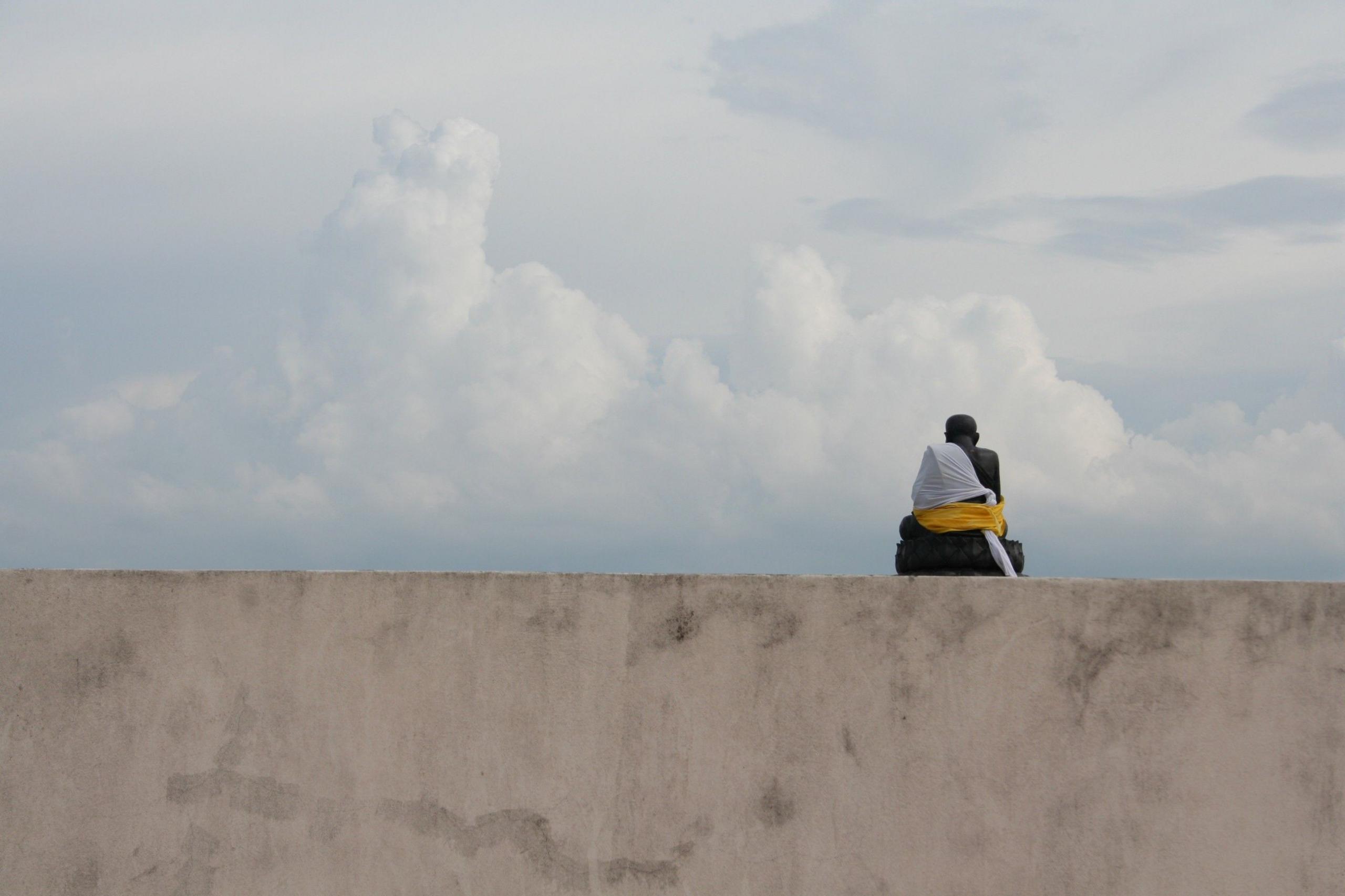 A person sitting on a wall