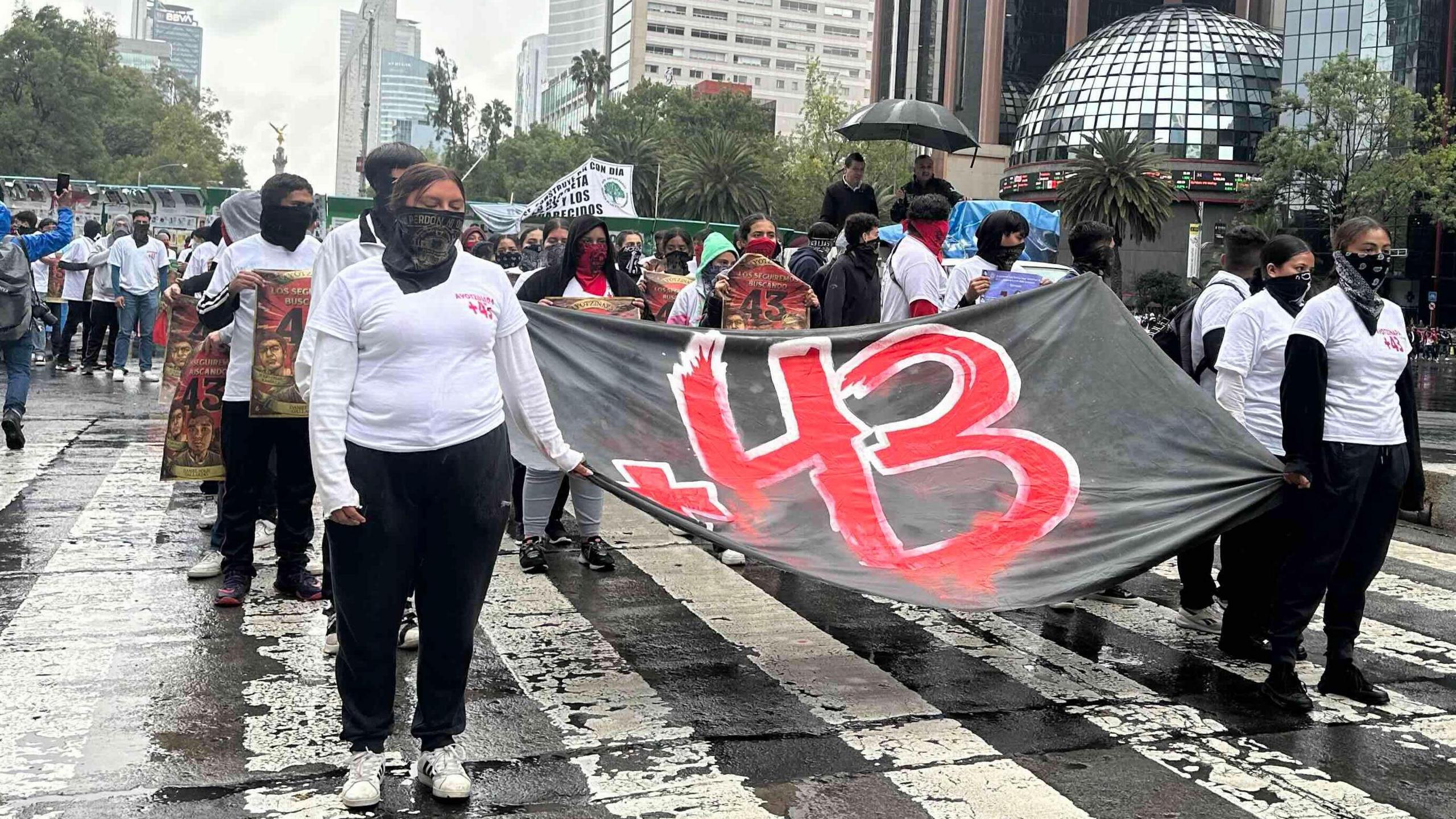 Protesters in Mexico City carrying a banner commemorating the 43 missing student teachers