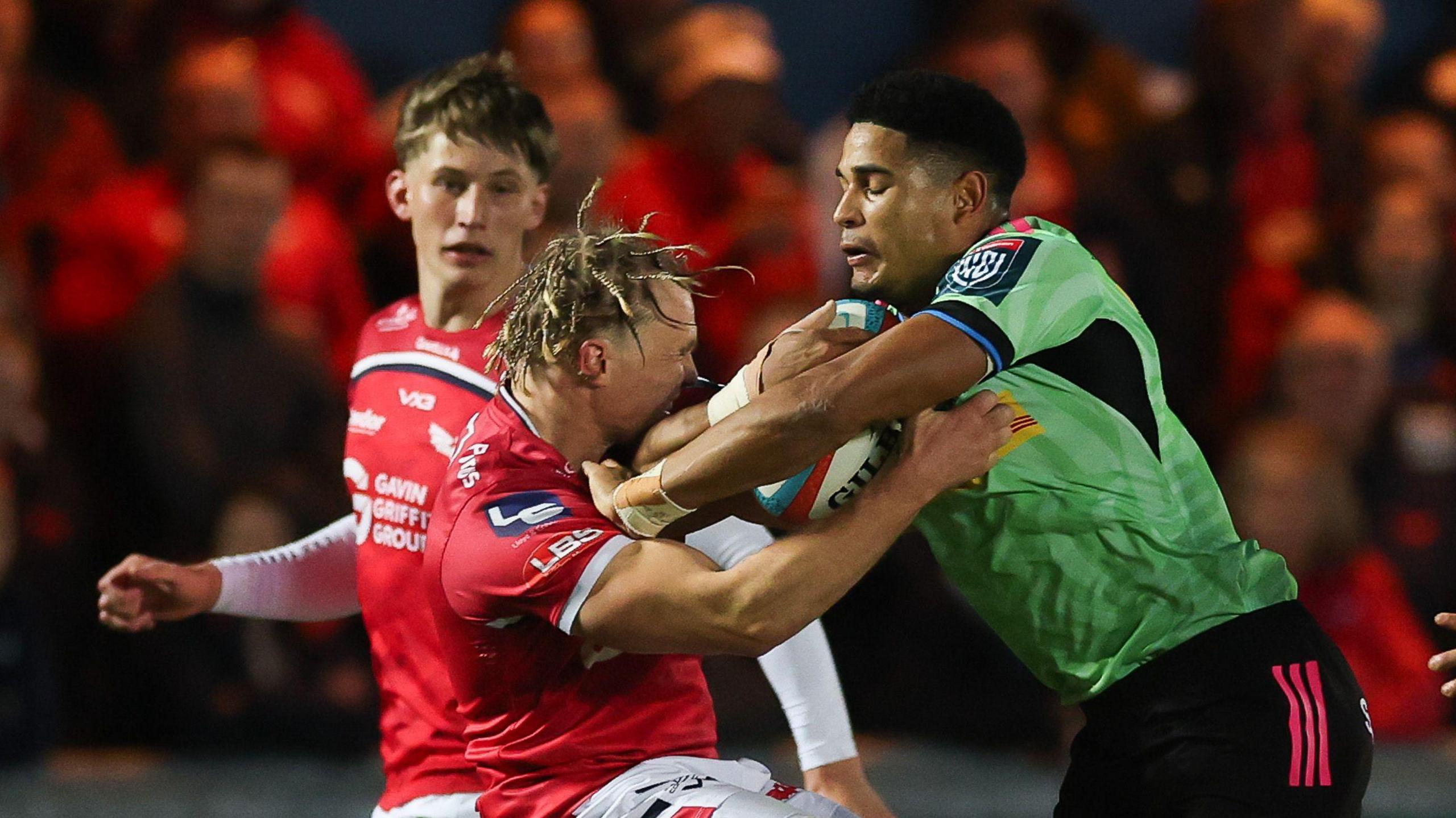  Sacha Feinberg-Mngomezulu of Stormers takes on Blair Murray of Scarlets