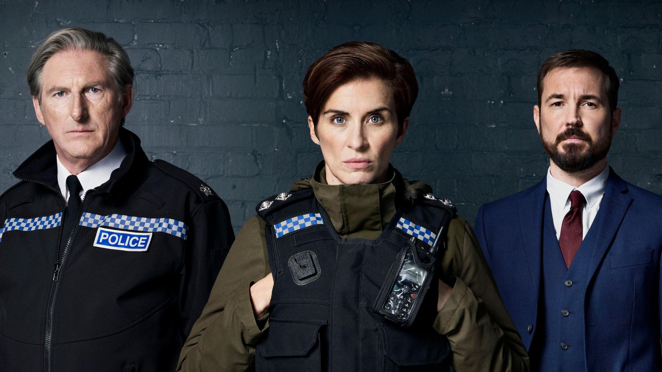 Adrian Dunbar, Vicky McClure and Martin Compston as their Line of Duty characters looking at the camera