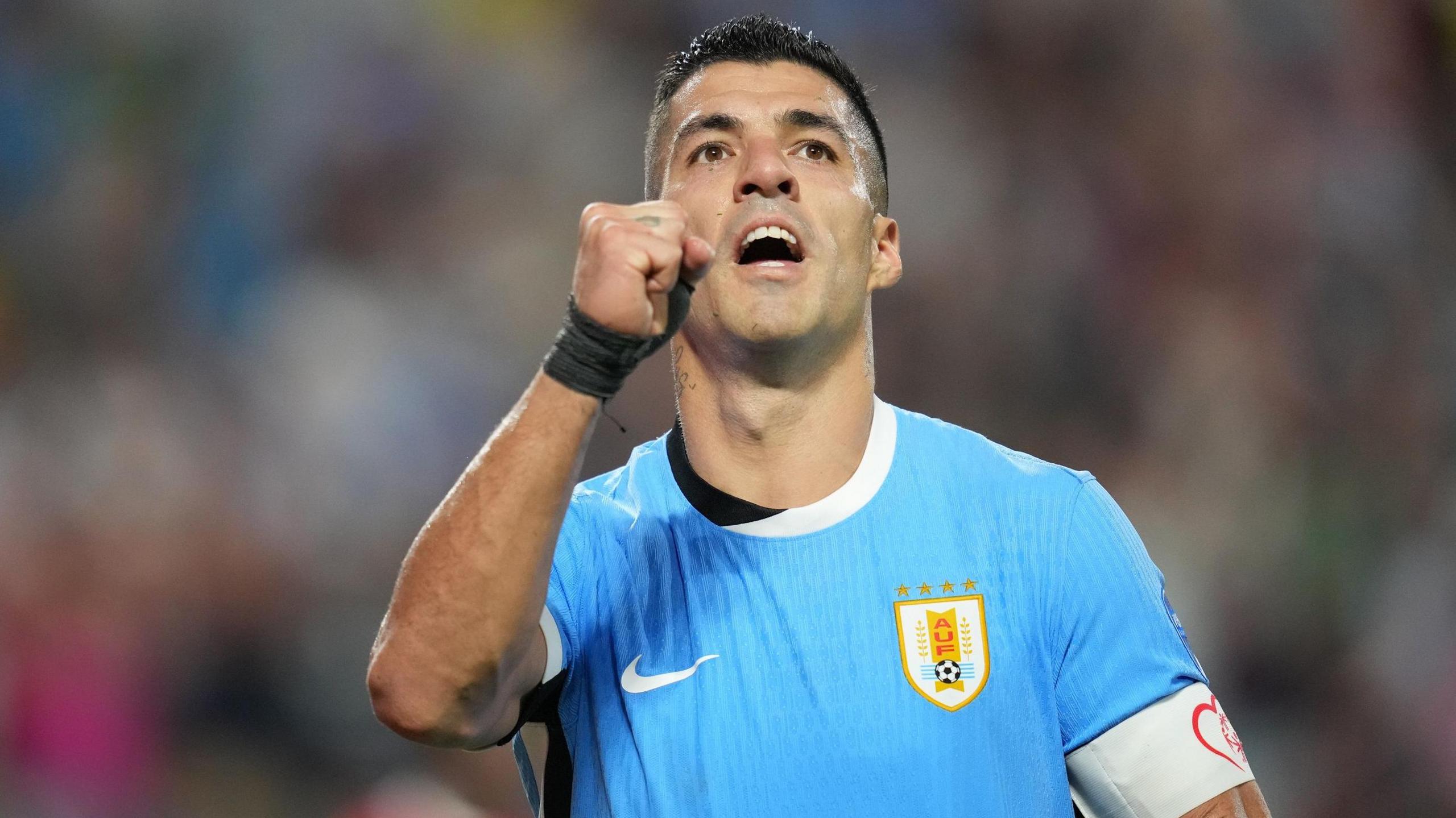 Luis Suarez celebrates scoring his penalty in the shoot out against Canada