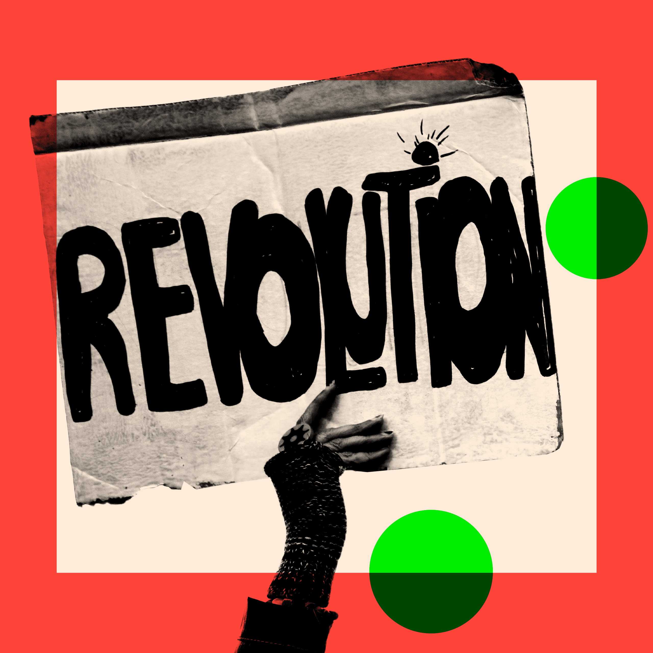 A hand holds a placard that says 'Revolution'