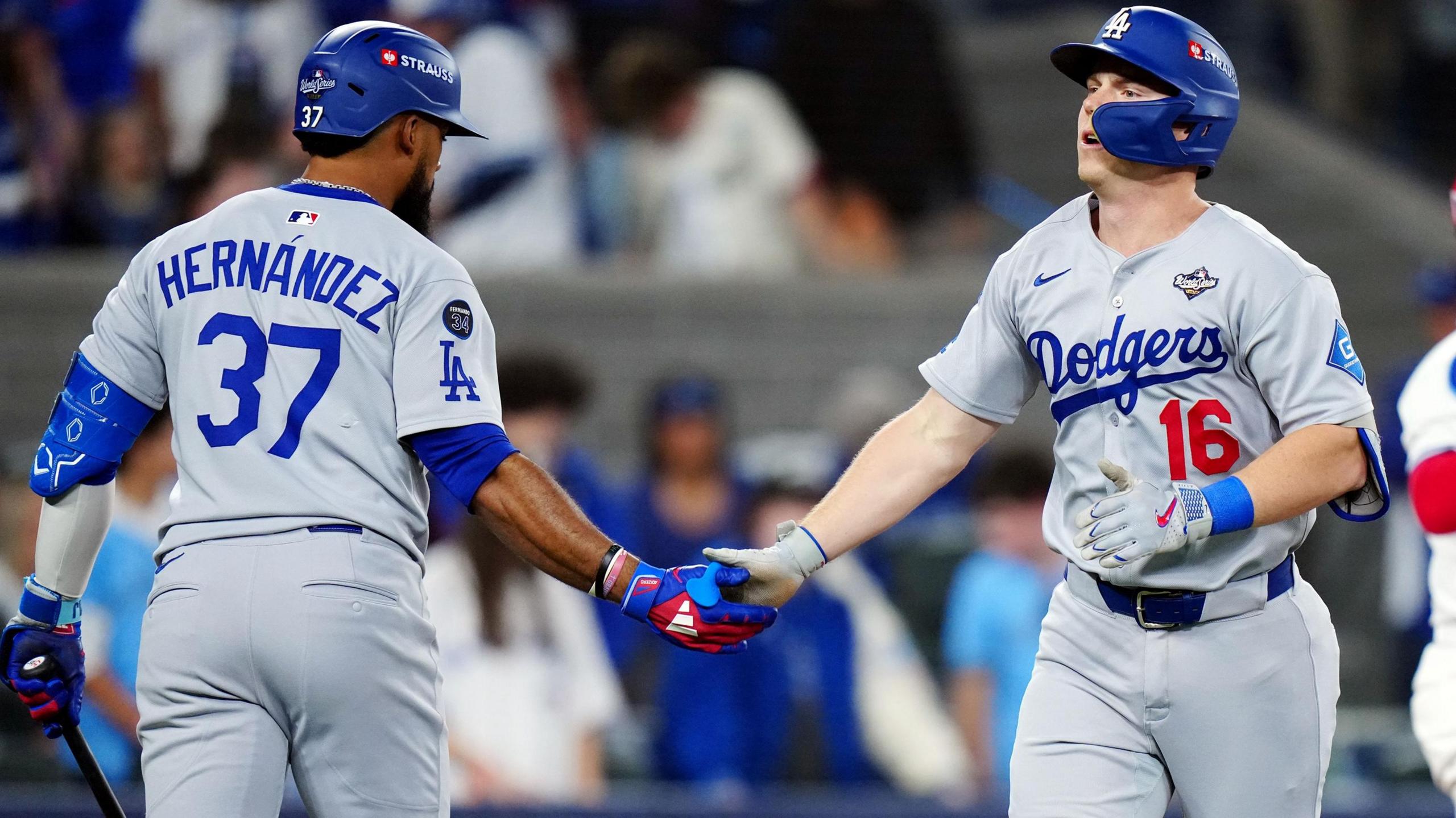 Will Smith (right) is congratulated on his home run by Teoscar Hernandez (left)