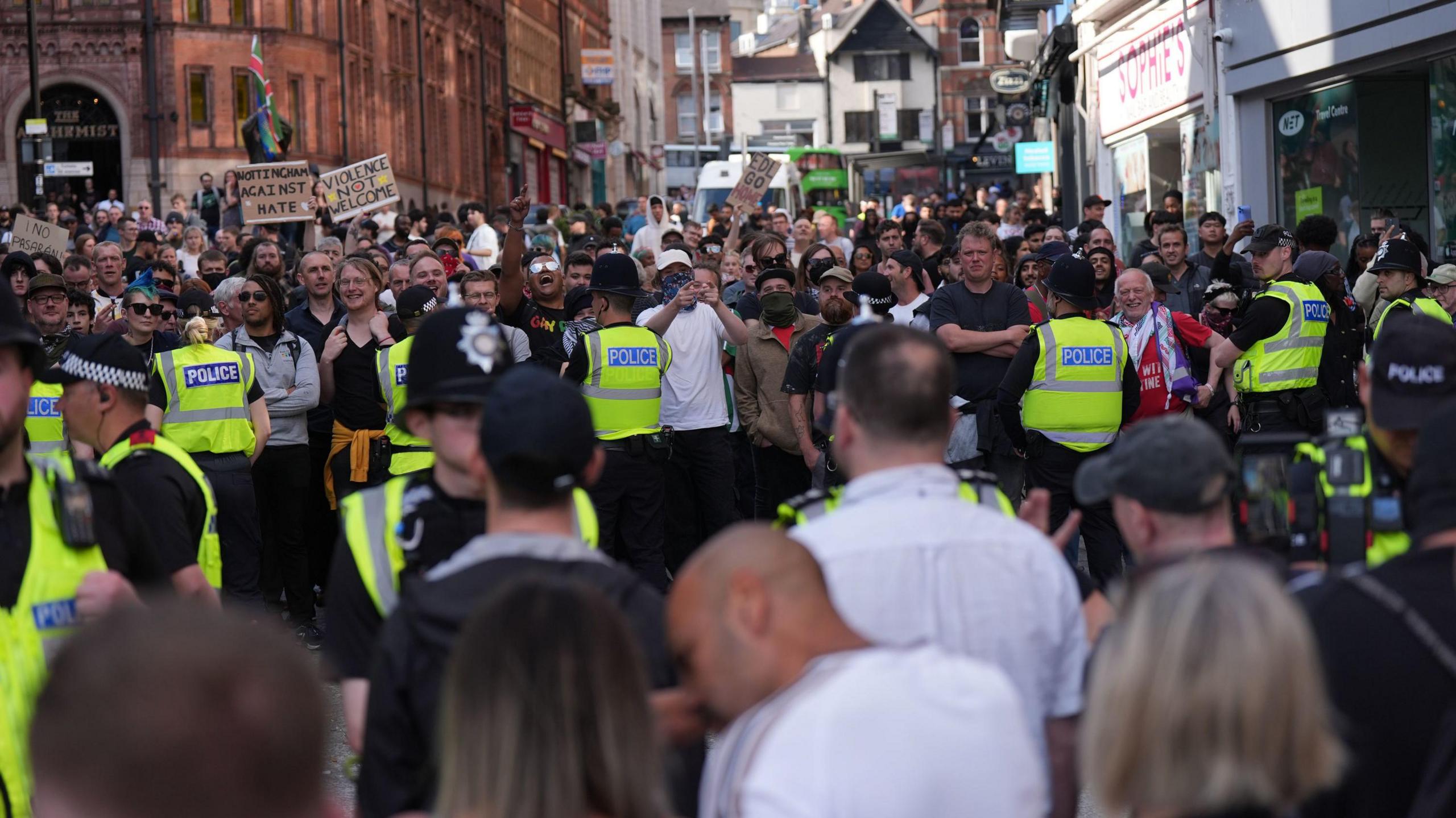 Two groups separated by police during protests in Nottingham city centre on 3 August