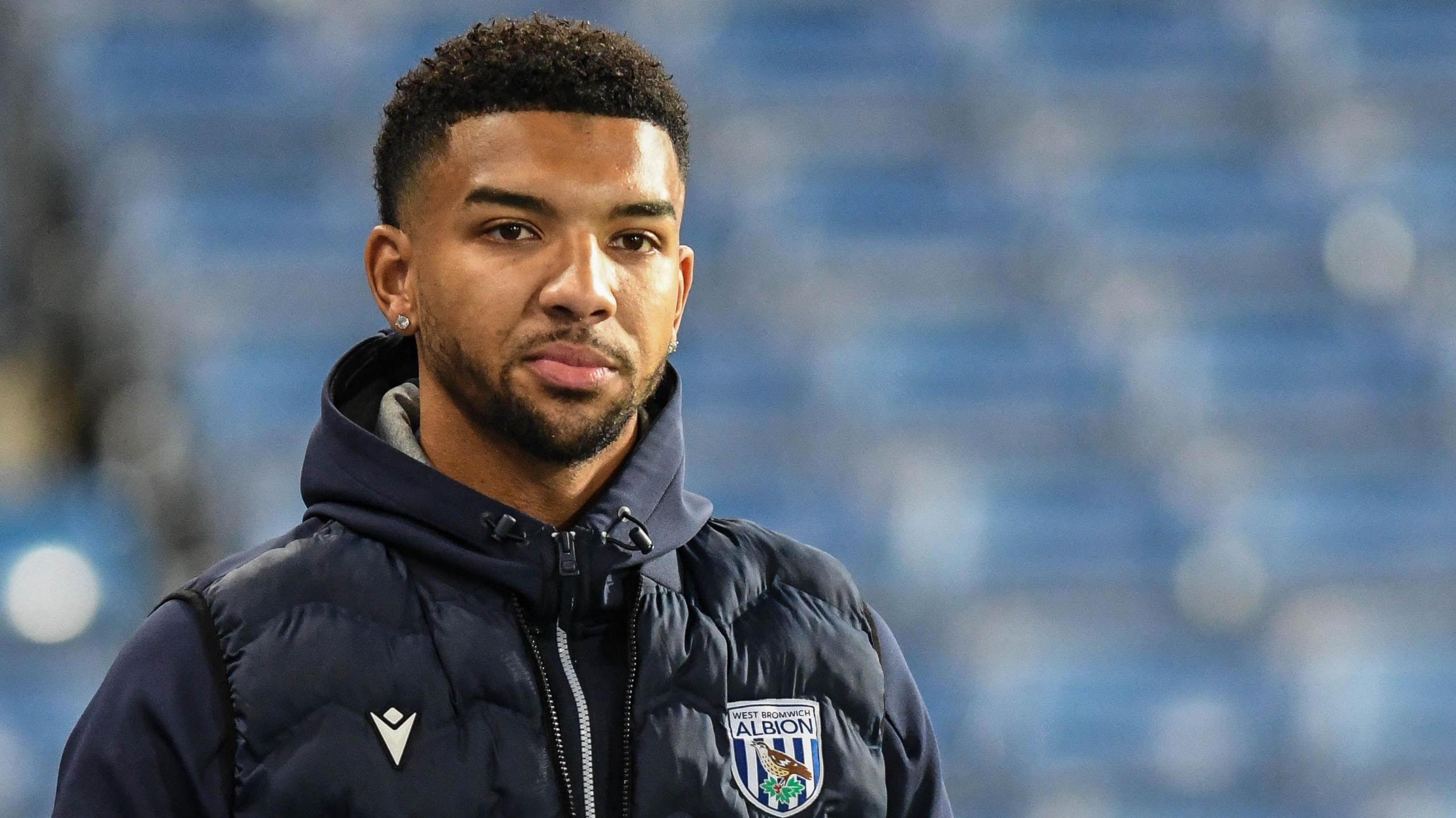 Mason Holgate wearing a West Bromwich Albion coat