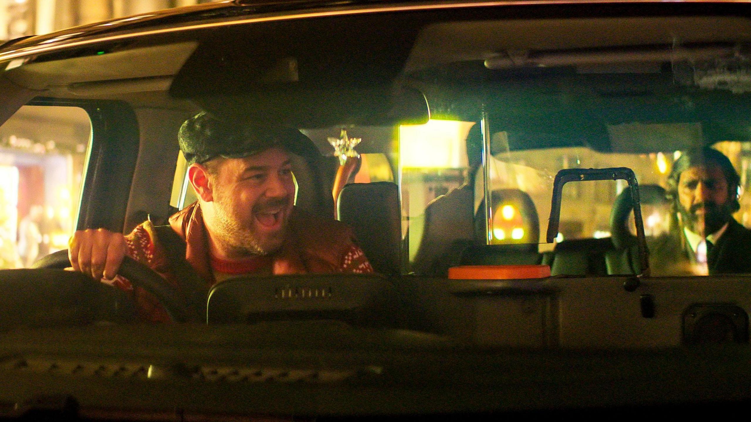 Danny Dyer and Kunal Nayyar in a black cab in Christmas Karma