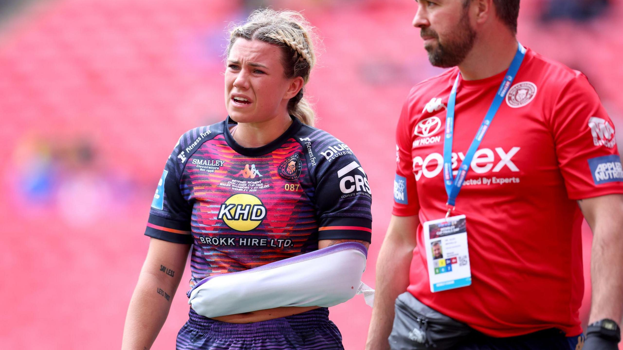 Emily Veivers walks off with her arm in a makeshift sling during Wigan's win over St Helens in Saturday's Women's Challenge Cup final at Wembley