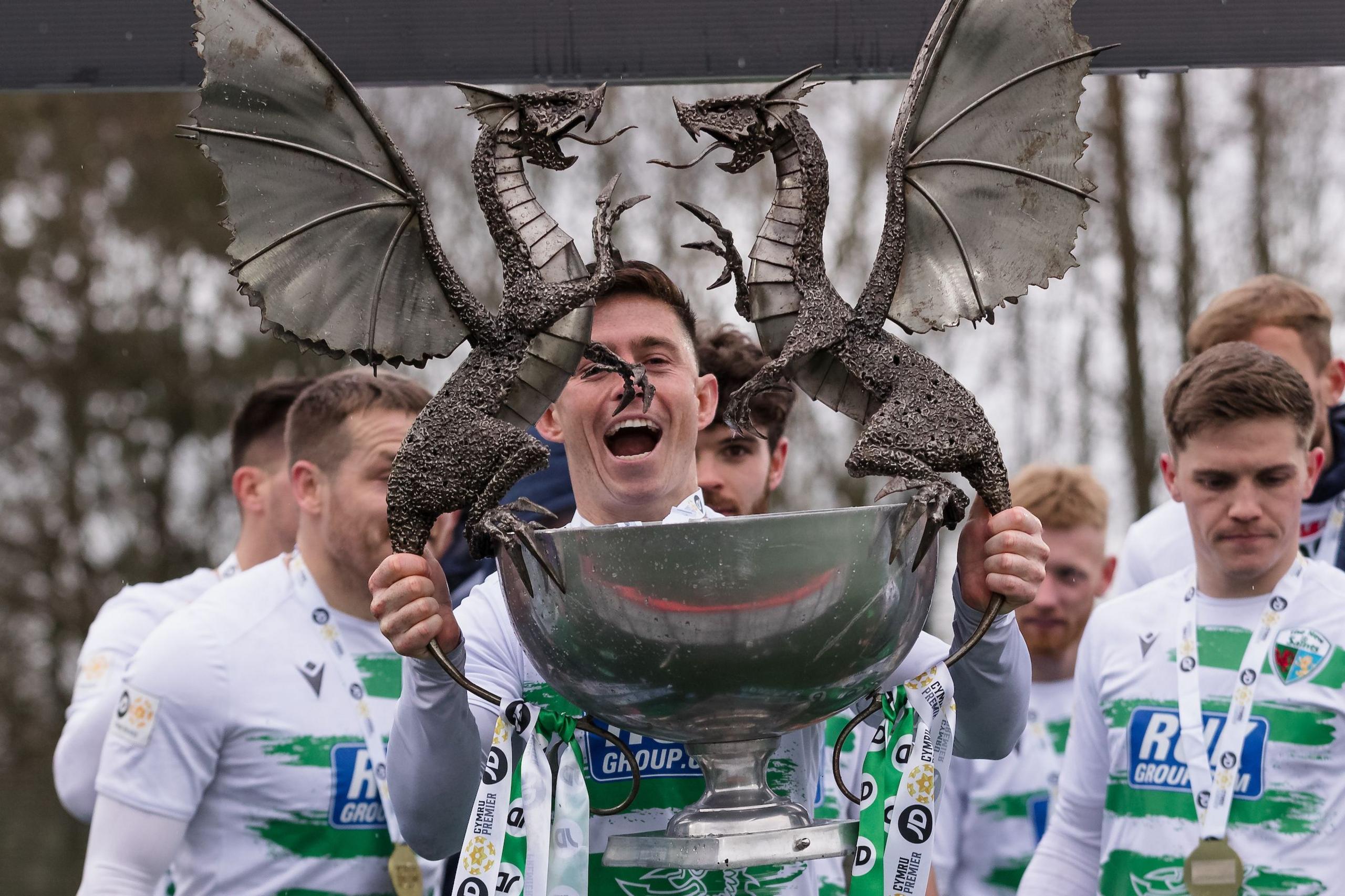 New Saints' Danny Redmond with the Cymru Premier trophy