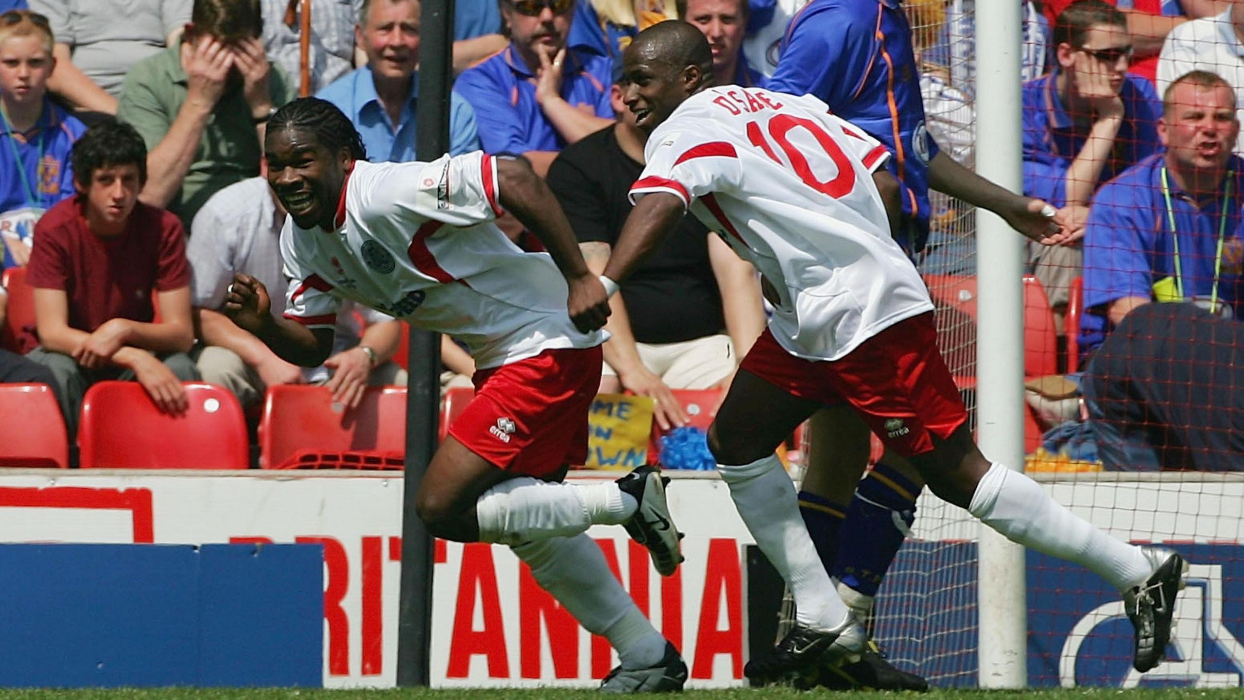 Aaron McLean (left) celebrates after putting Aldershot Town ahead in their National League play-off final against Shrewsbury Town in 2004