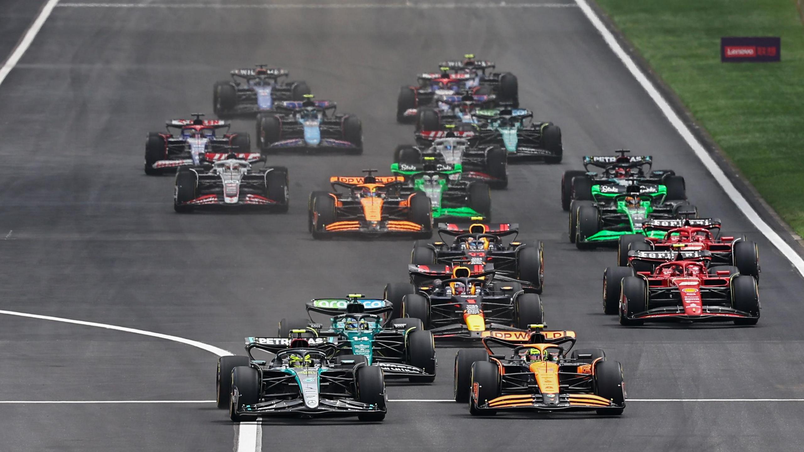 Lewis Hamilton leads Lando Norris into the first corner during the 2024 Chinese Grand Prix sprint race