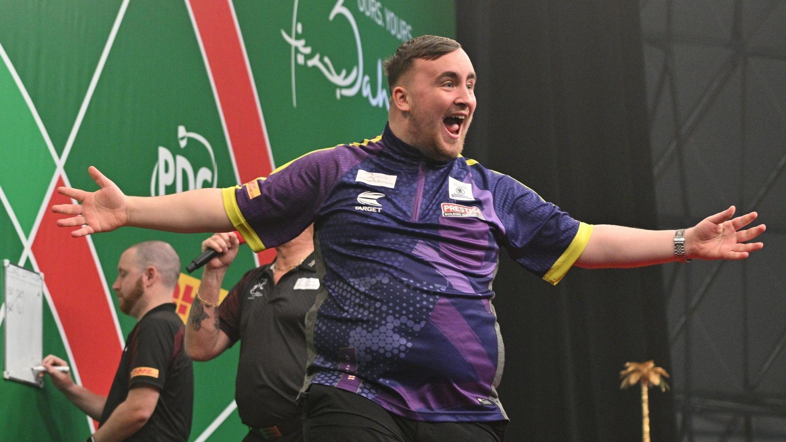 Luke Littler celebrates beating Michael van Gerwen (not pictured) in the final of the Bahrain Darts Masters