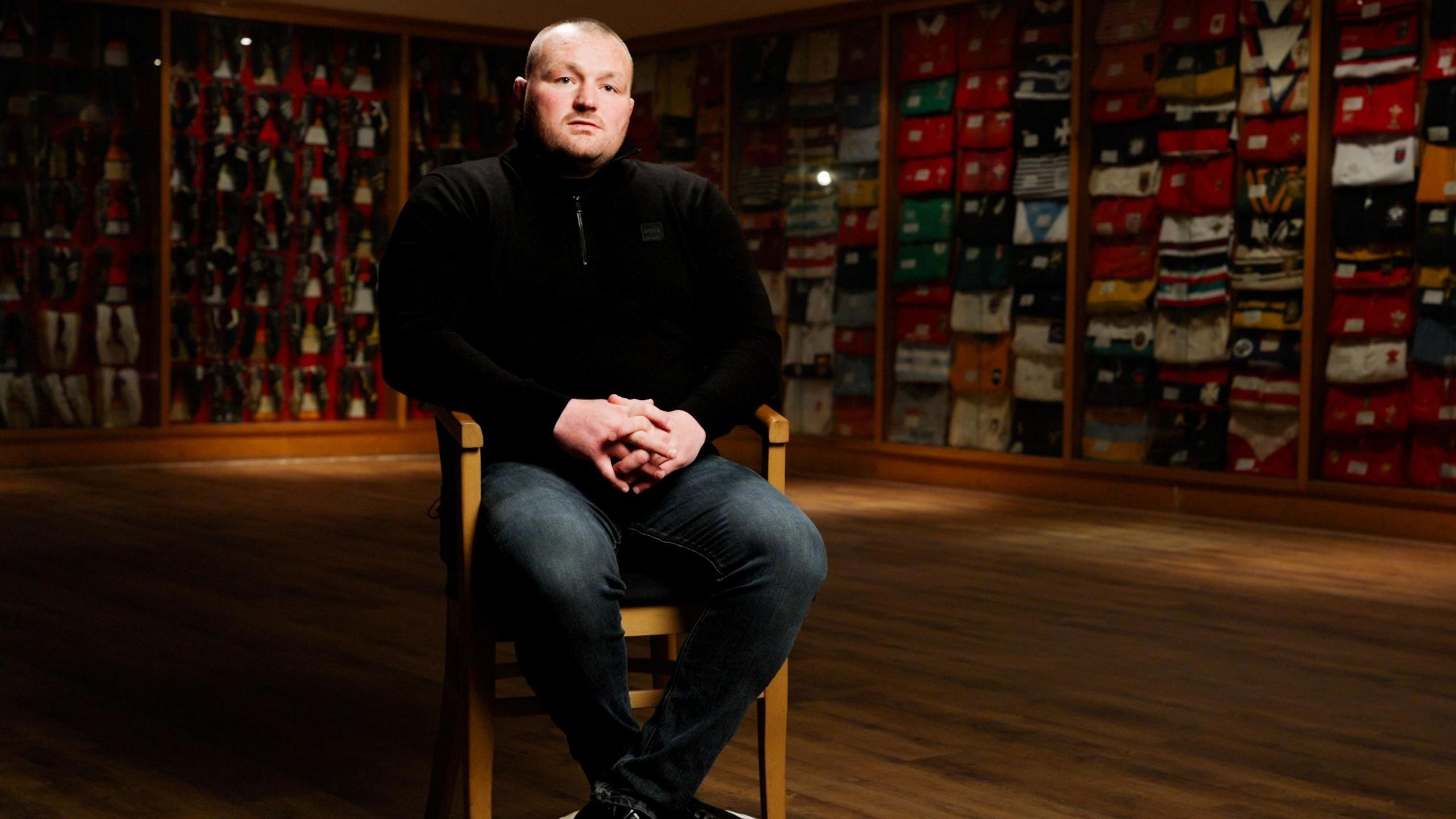 Ken Owens sitting in the Carmarthen Athletic clubhouse