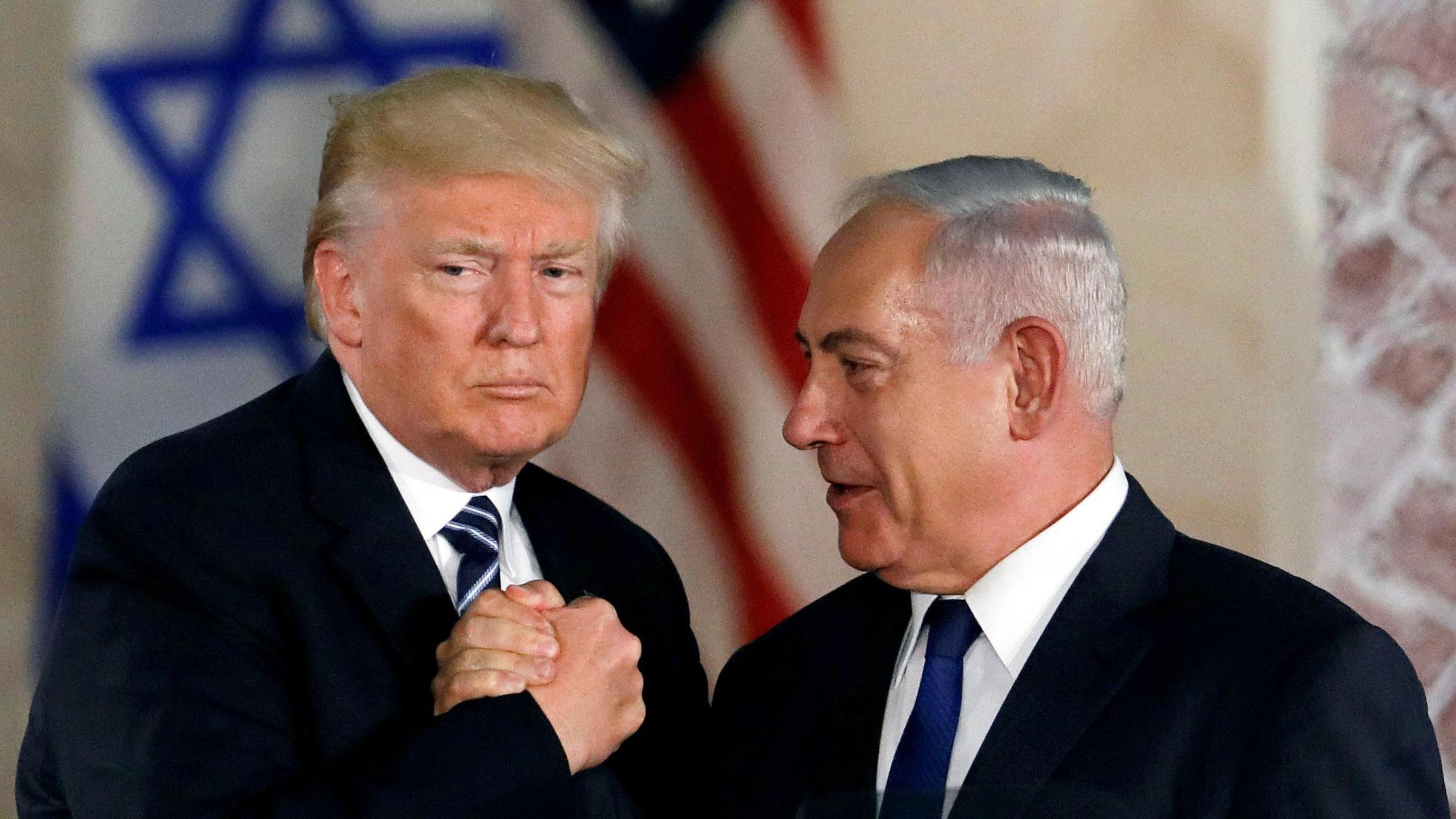 President Donald Trump and Israeli Prime Minister Benjamin Netanyahu shake hands after Trump's address at the Israel Museum in Jerusalem 