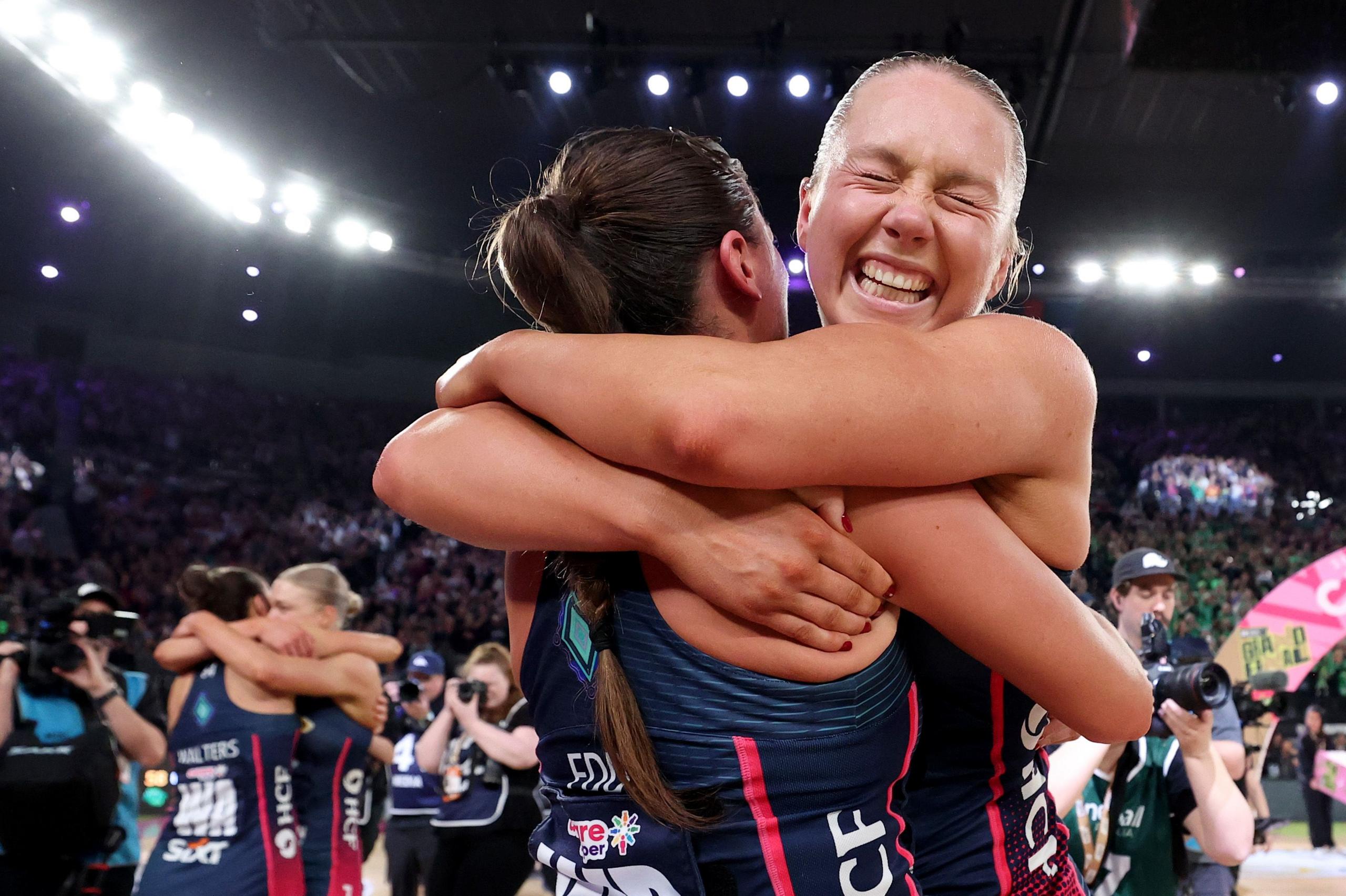 The Vixens' Hannah Mundy and Kate Eddy celebrate winning the 2025 Super Netball Grand Final match between West Coast Fever and Melbourne Vixens at Rod Laver Arena in Melbourne, Australia. Photo by Kelly Defina