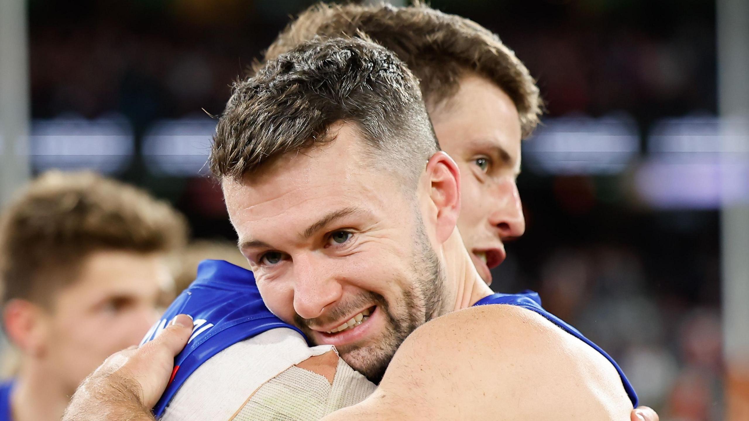 Conor McKenna celebrates pinch team-mate Jarrod Berry aft Brisbane Lions' triumph complete Geelong past weekend