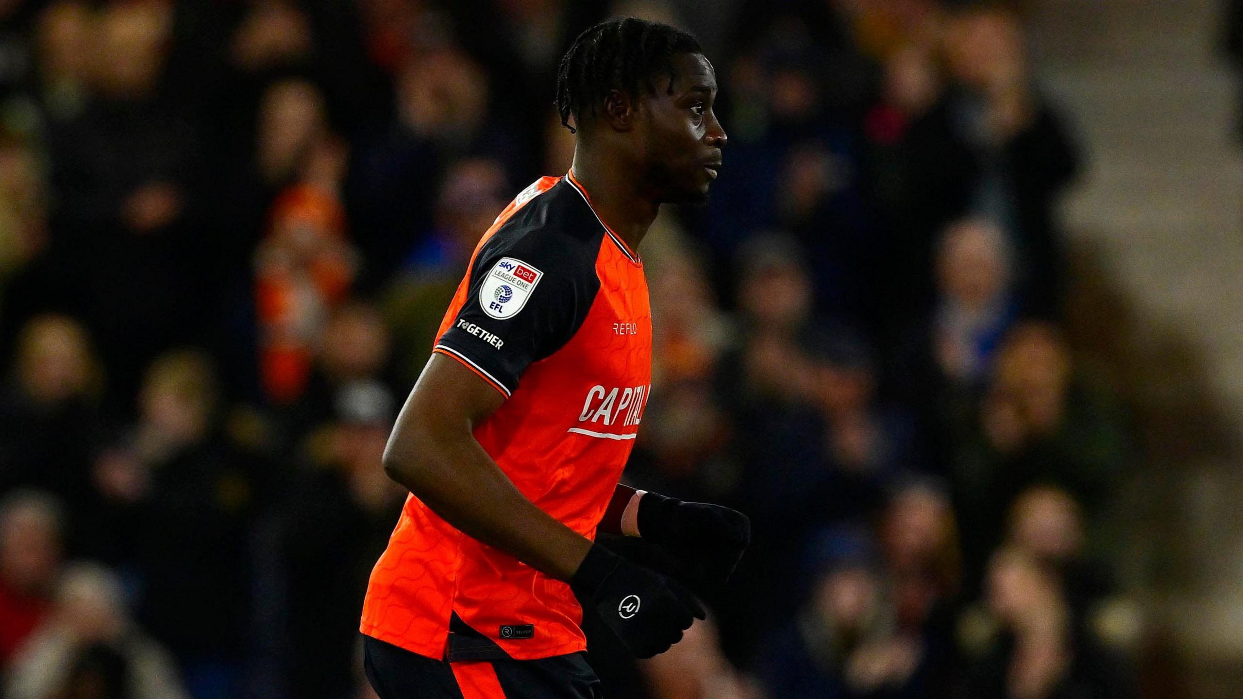 Elijah Adebayo playing for Luton Town against Exeter