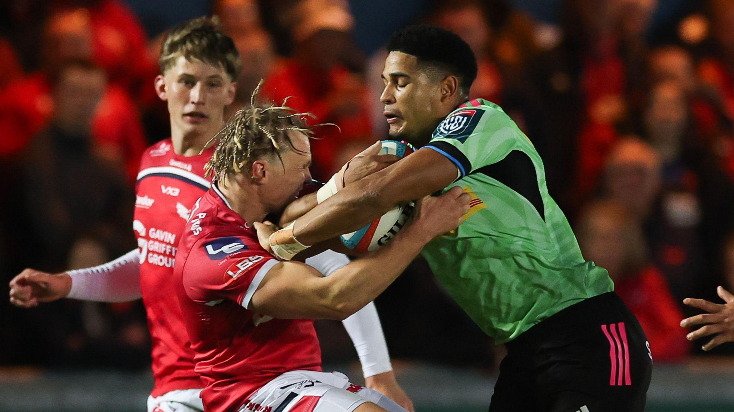  Sacha Feinberg-Mngomezulu of Stormers takes on Blair Murray of Scarlets