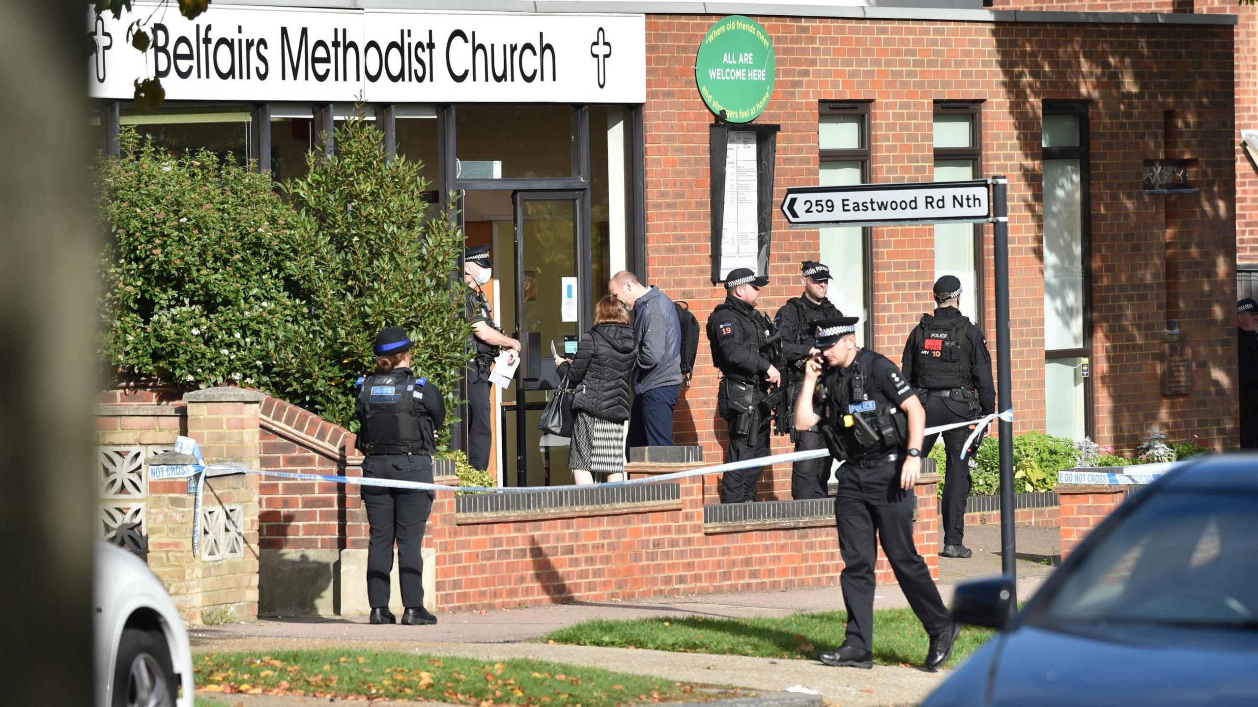 Armed police officers outside the Belfairs Methodist Church in Eastwood Road North, Leigh-on-Sea, Essex.