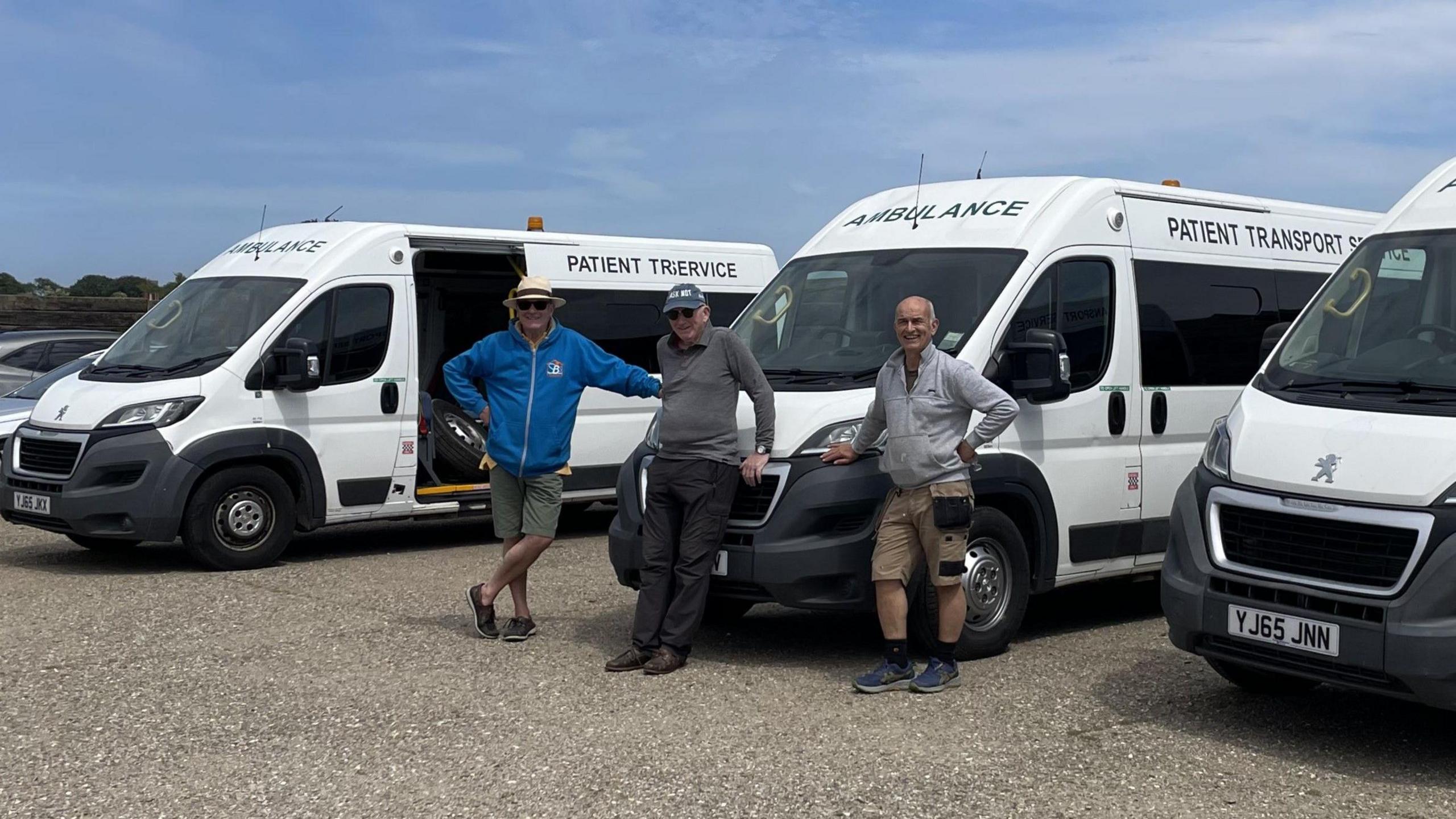 John Nickell-Lean (middle) has organised for four ambulances filled with medical essentials to be transported to Ukraine