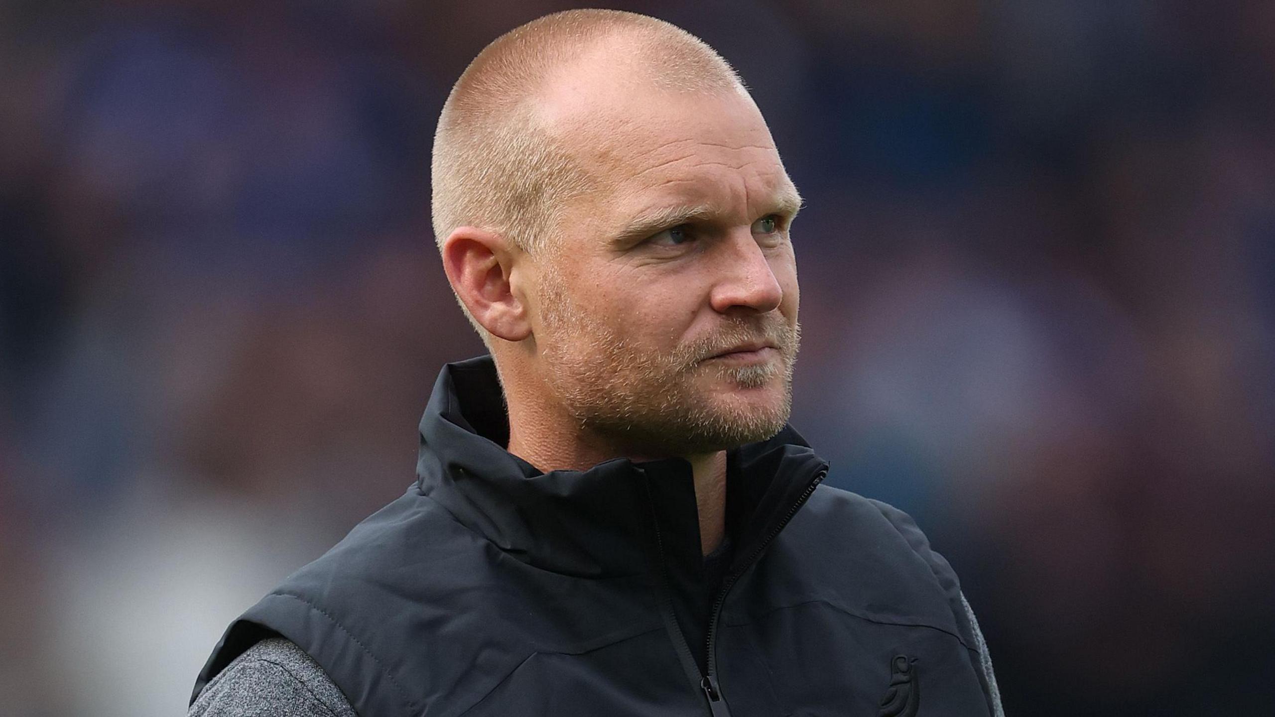 Liam Manning during a game while managing Norwich City