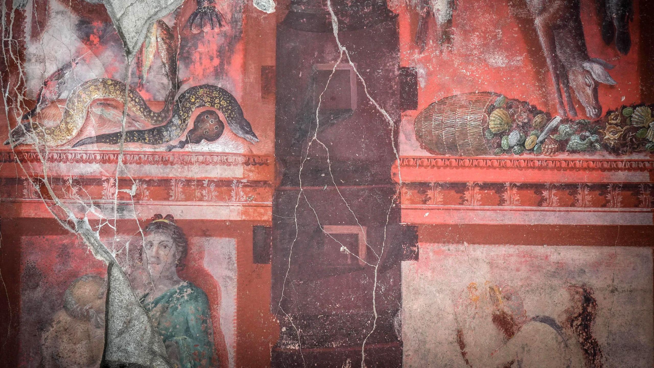 A banquet hall decorated with a large fresco