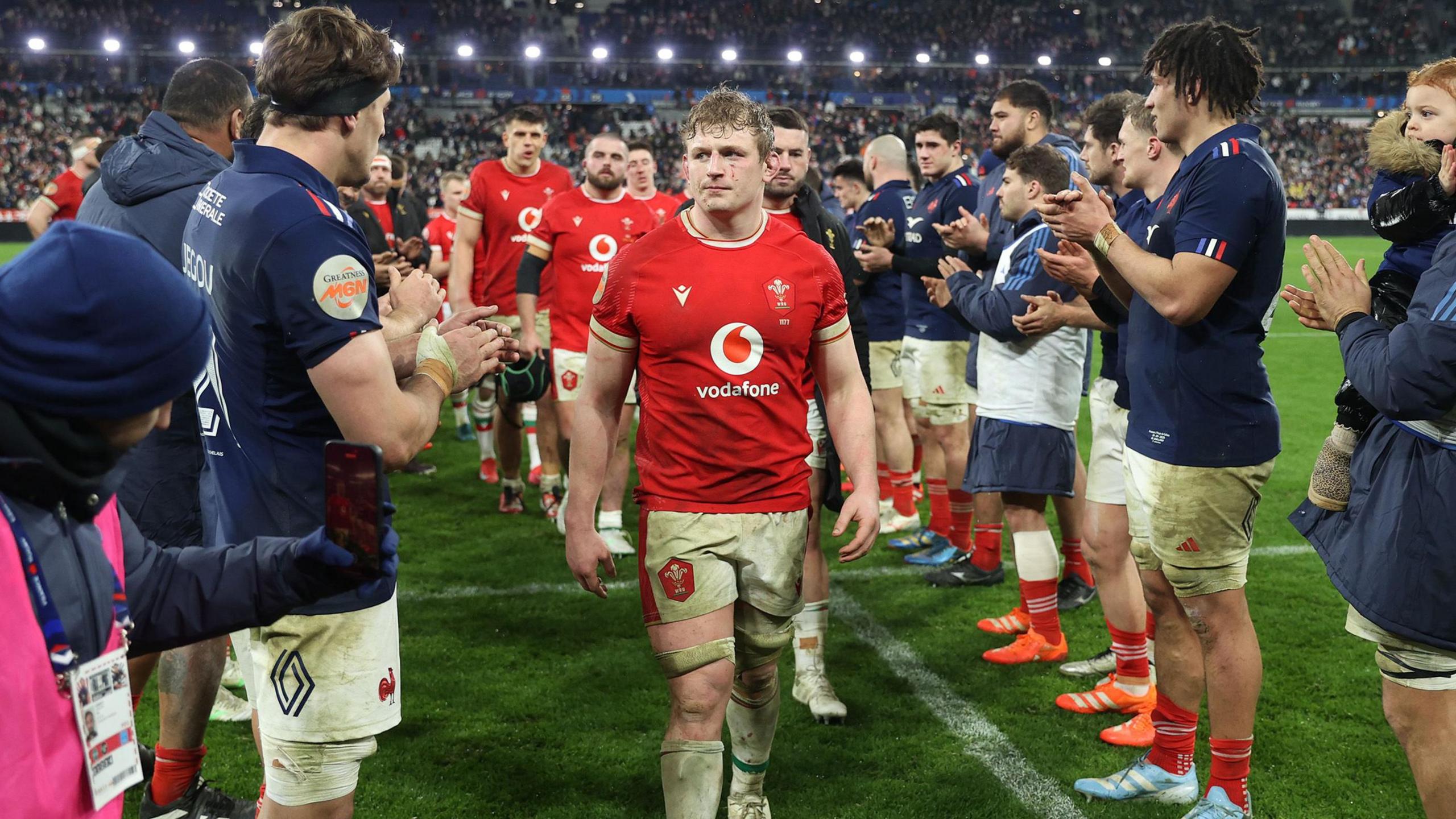 Jac Morgan leads Wales off the field against France