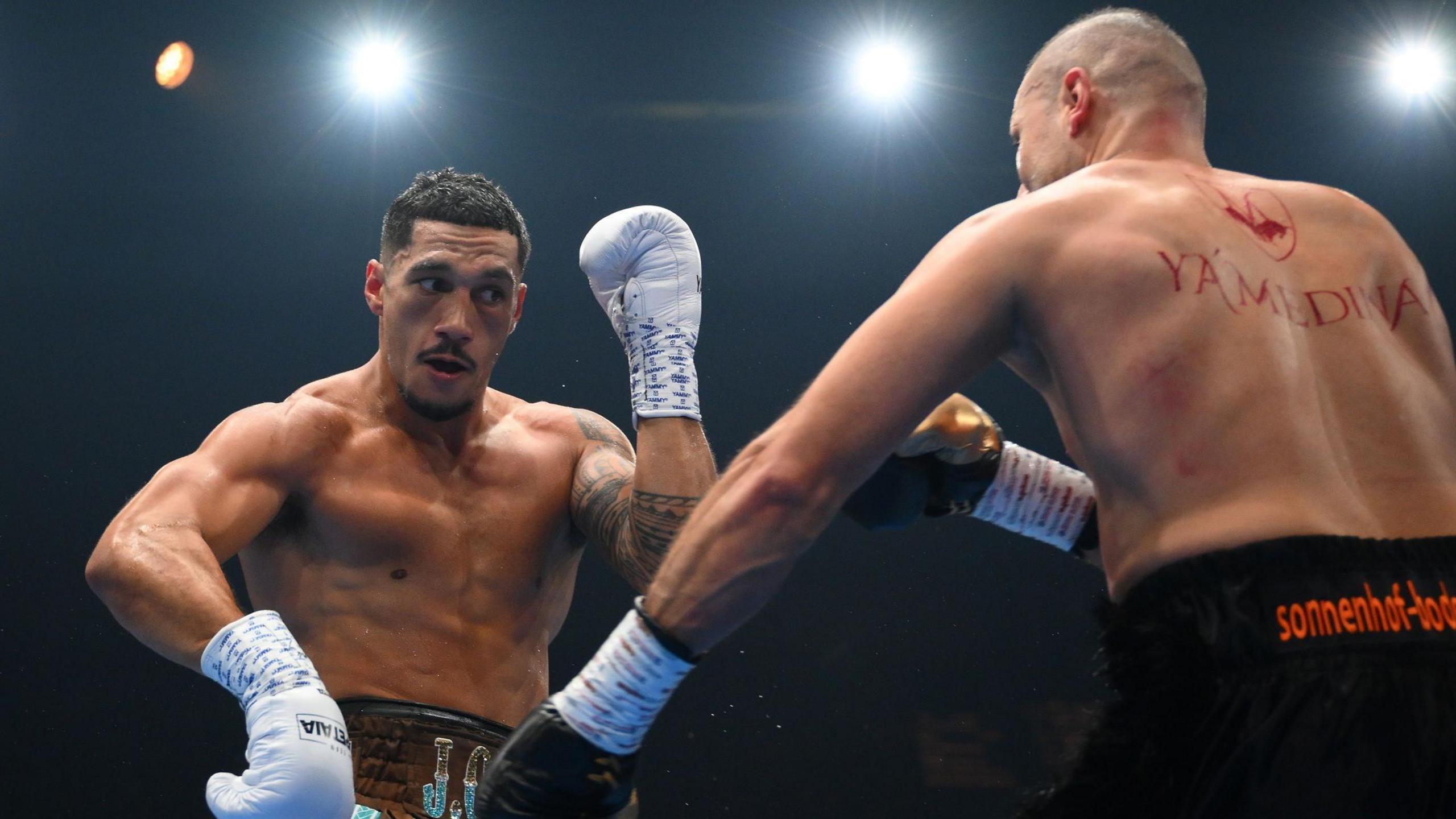 Jai Opetaia (left) in action during his fight against Huseyin Cinkara in December