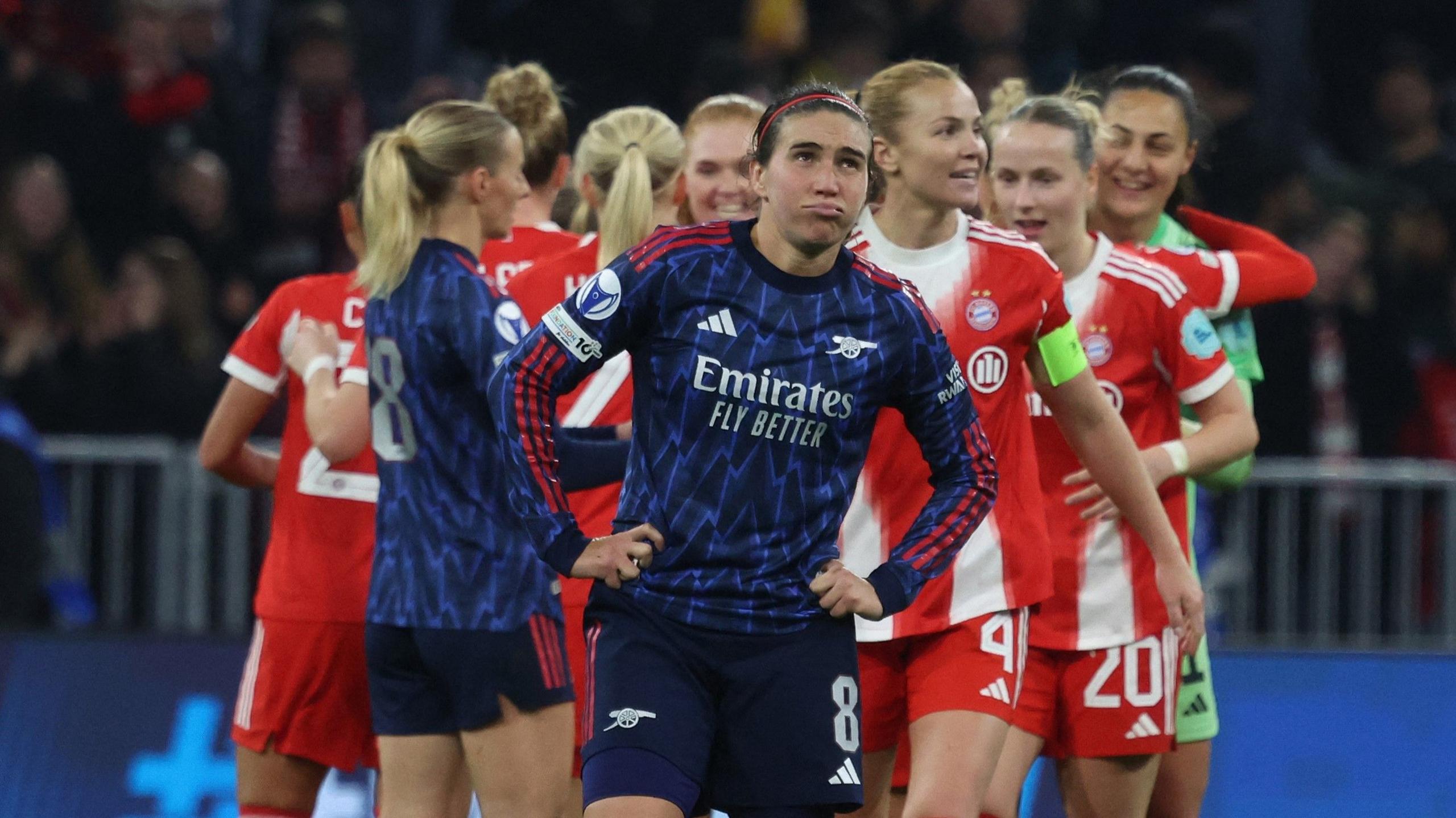Mariona Caldentey looks disappointed as Bayern Munich celebrate Champions League win