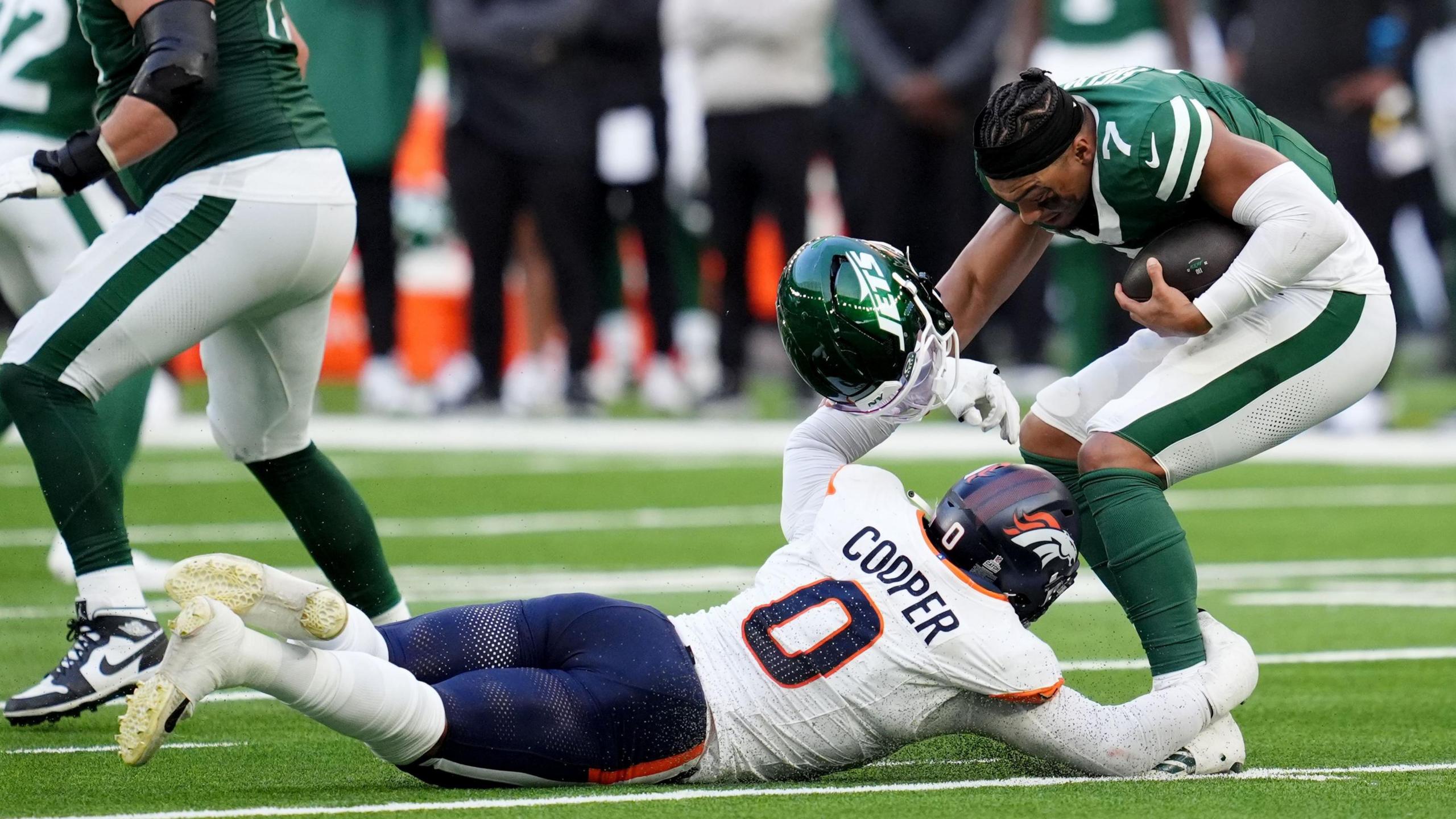 New York Jets quarterback Justin Fields is sacked by the Denver Broncos' Jonathon Cooper


