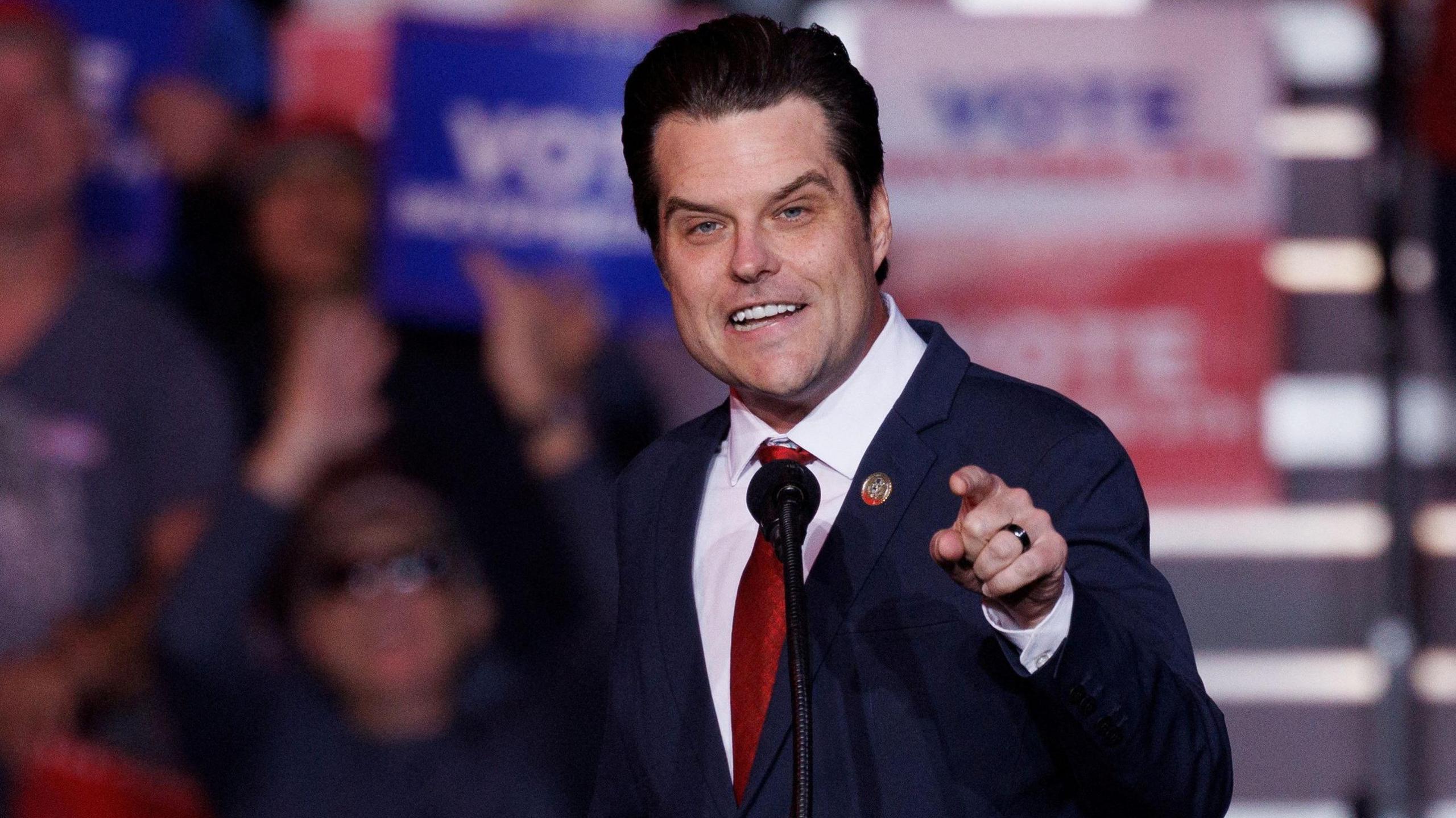 Matt Gaetz pointing at a crowd, gesturing while speaking at a rally for Donald Trump