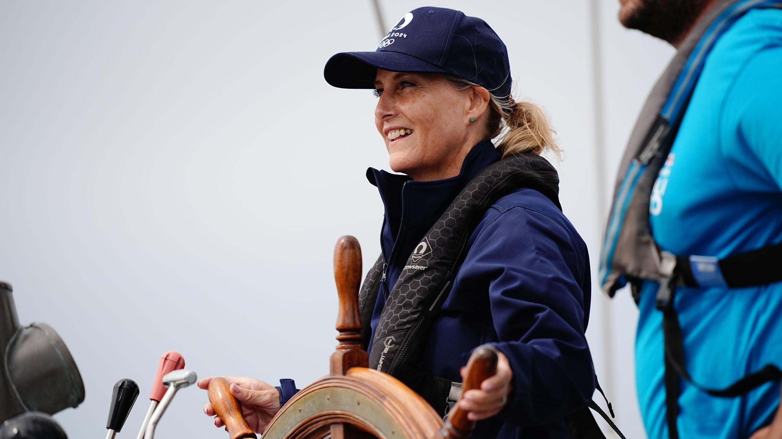 The Duchess of Edinburgh takes the helm on board the Ocean Youth Trust South's vessel the Prolific, during her visit to Guernsey