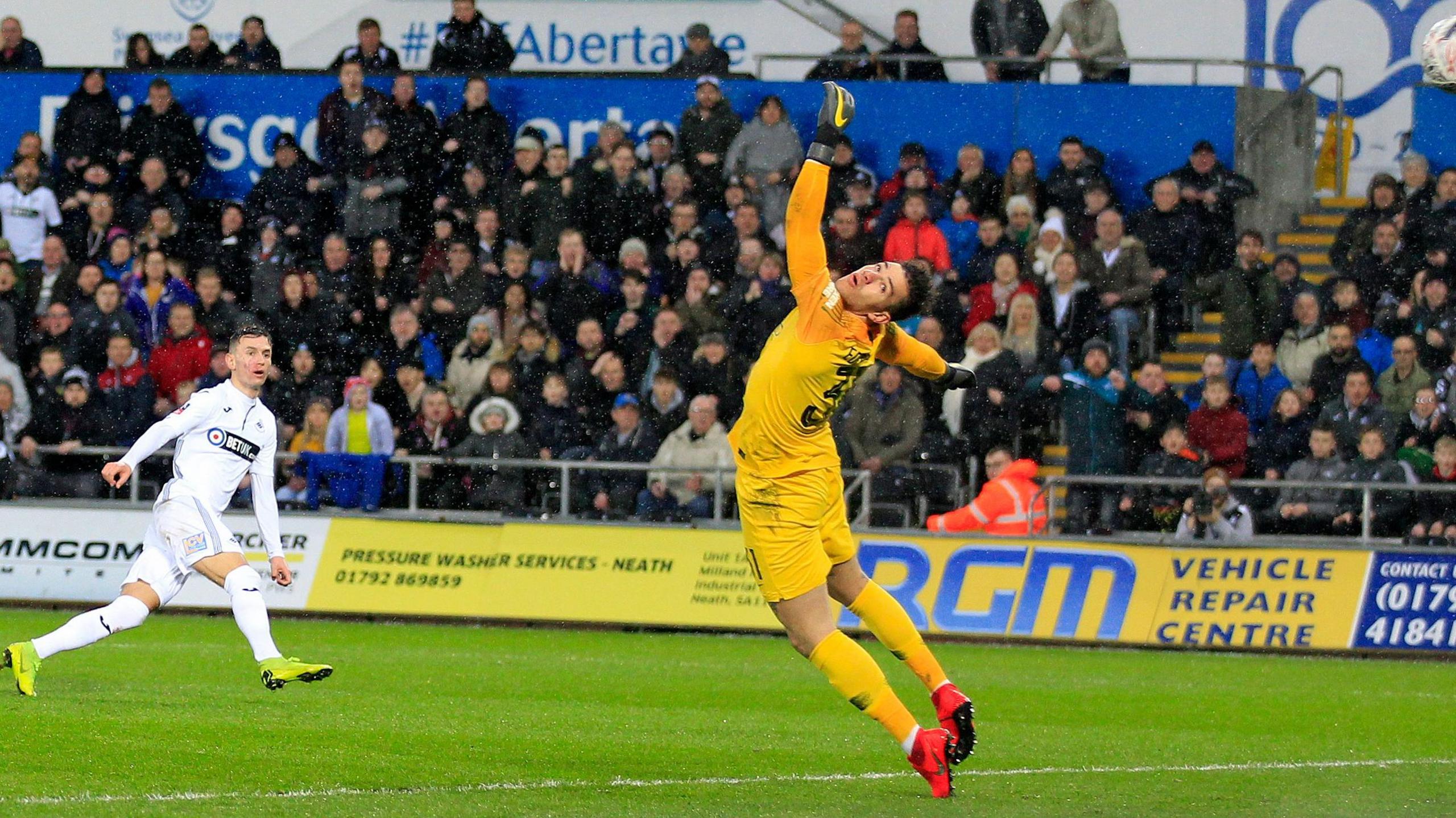Swansea City's Bersant Celina scores against Manchester City in the quarter-finals of the FA Cup