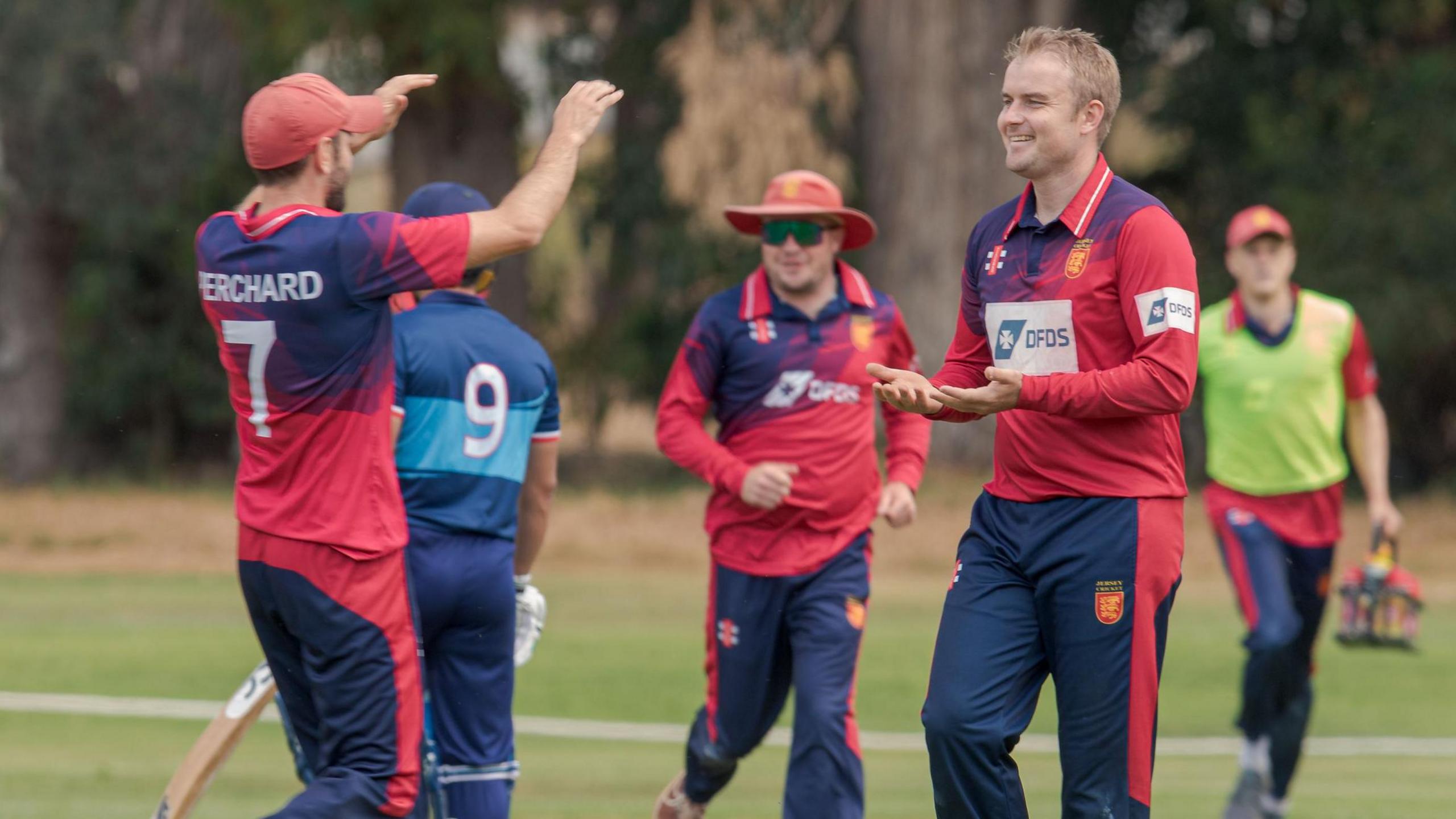 Charles Perchard and Dominic Blampied celebrate a wicket for Jersey