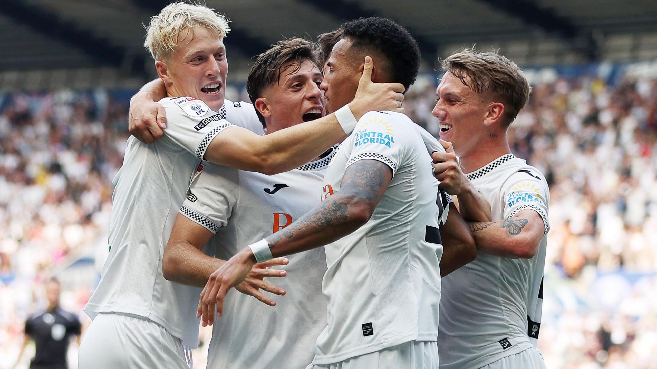 Swansea players celebrate against Sheffield United last month