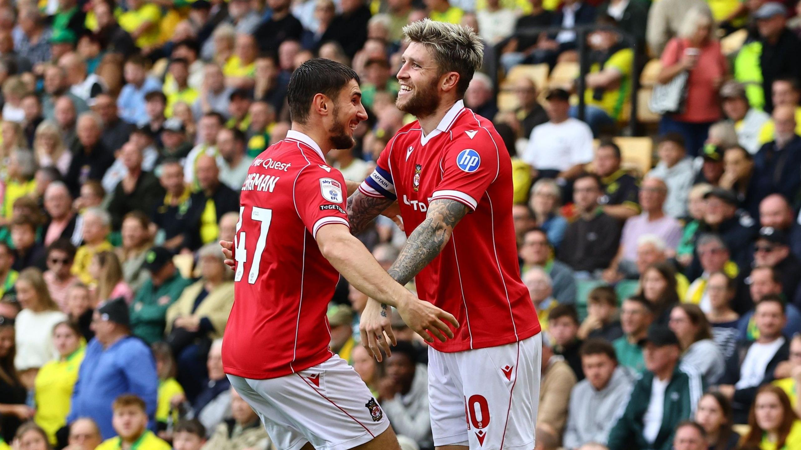 Wrexham's Josh Windass (R) celebrates with team-mate Ryan Longman