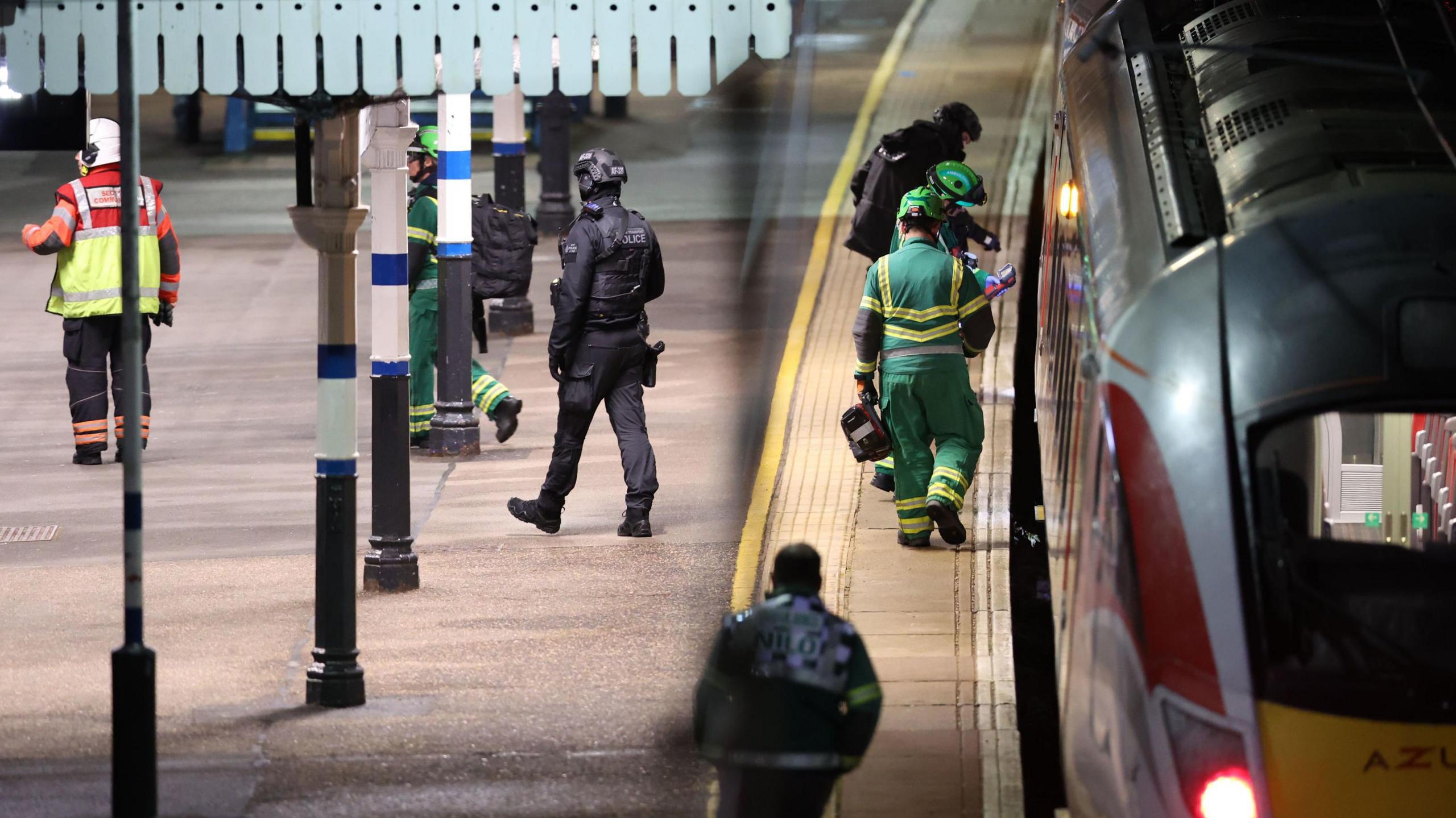 A stationary LNER AZUMA train which had been travelling from Doncaster to London King's Cross, at a platform at Huntingdon railway station. A number of emergency services personnel are walking up and down the platform.