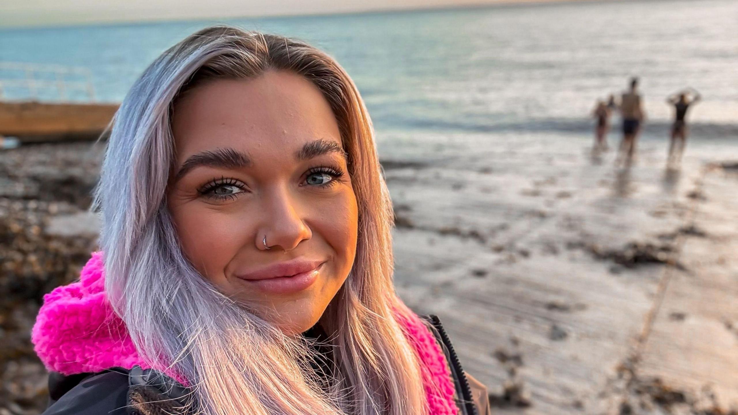 Selfie of girl on beach smiling 