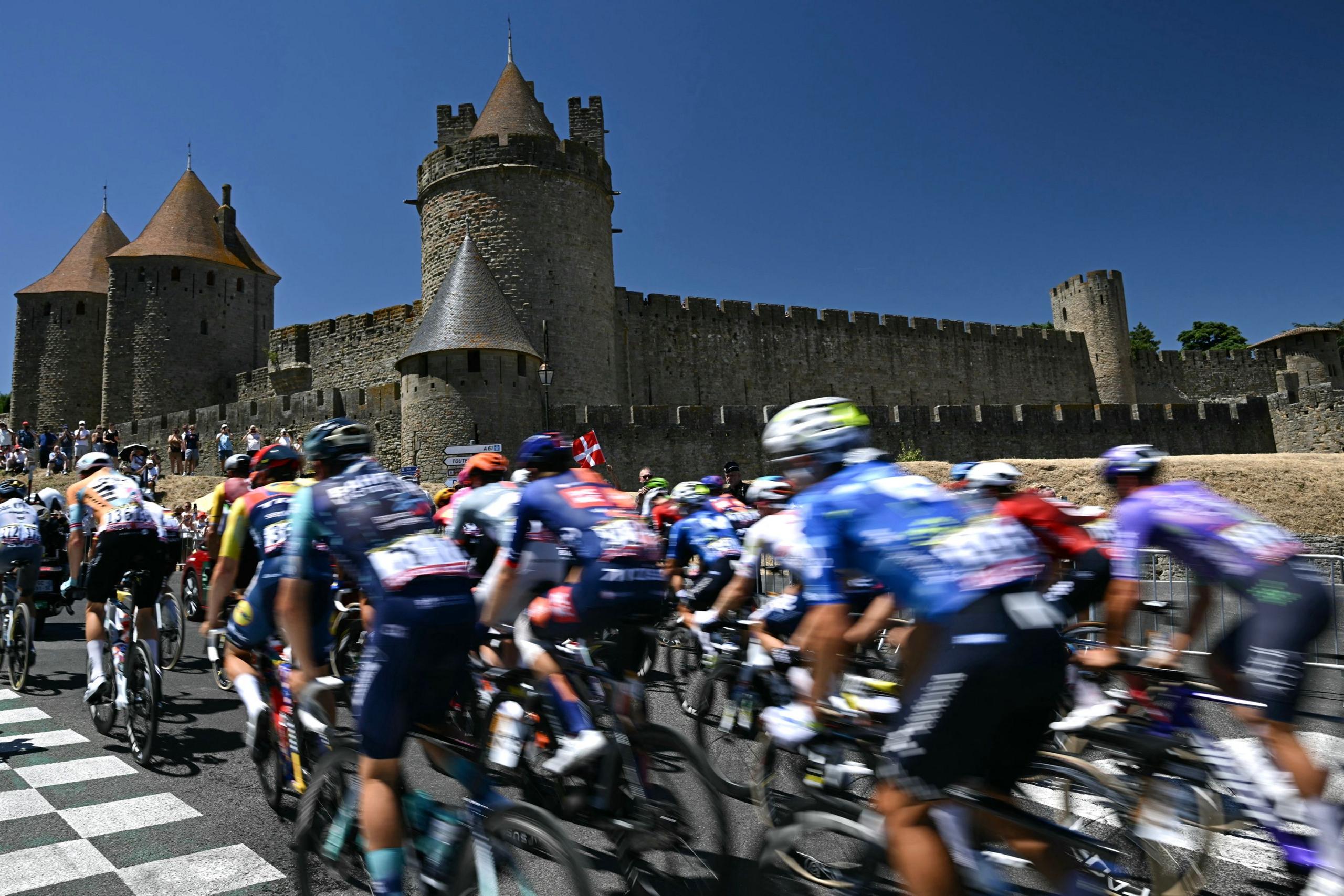 The peloton pass the spectacular Cité de Carcassonne, a famous medieval fortress at the start of stage four