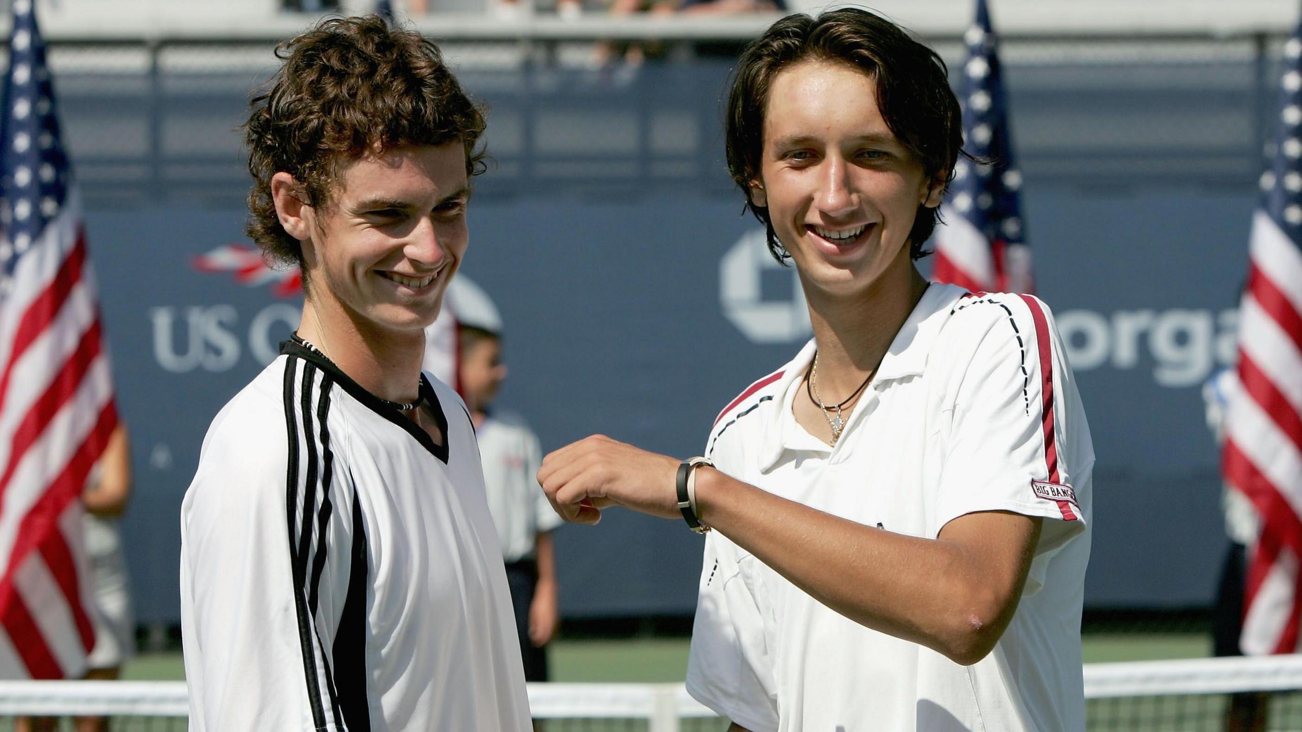 Andy Murray and Sergiy Stakhovsky pose after their junior US Open final