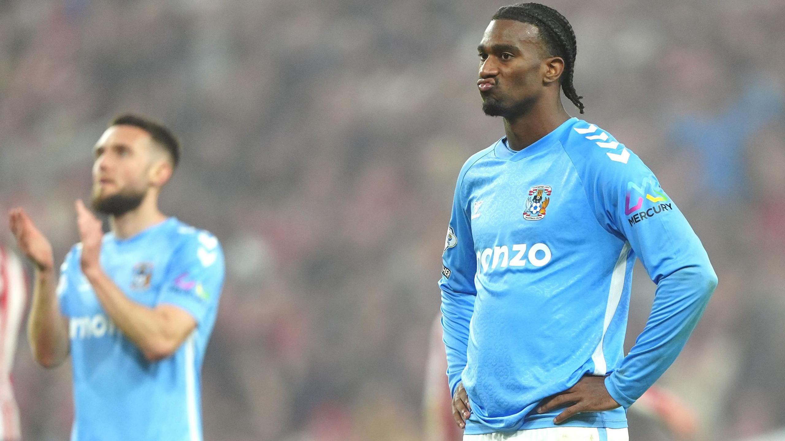 Haji Wright [right] reacts after losing the Championship play-off semi-final to Sunderland