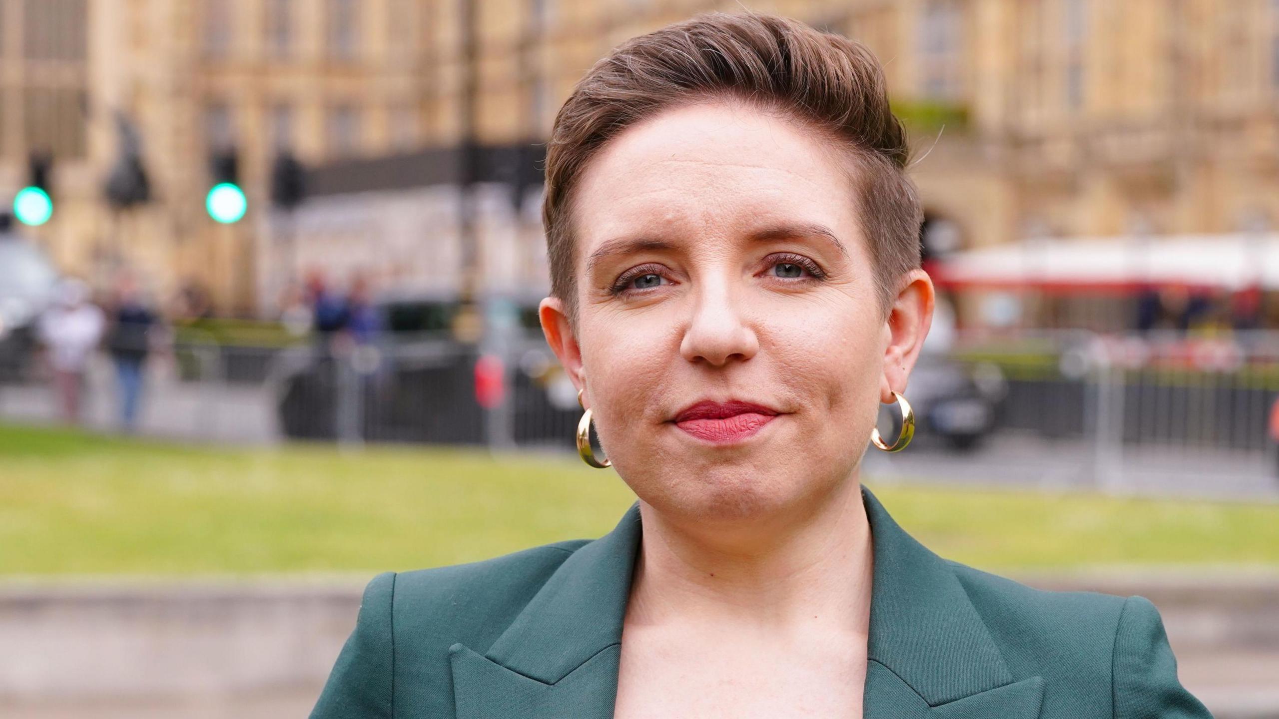 Carla Denyer, the new co-leader for the Green party stands for a photo on College Green