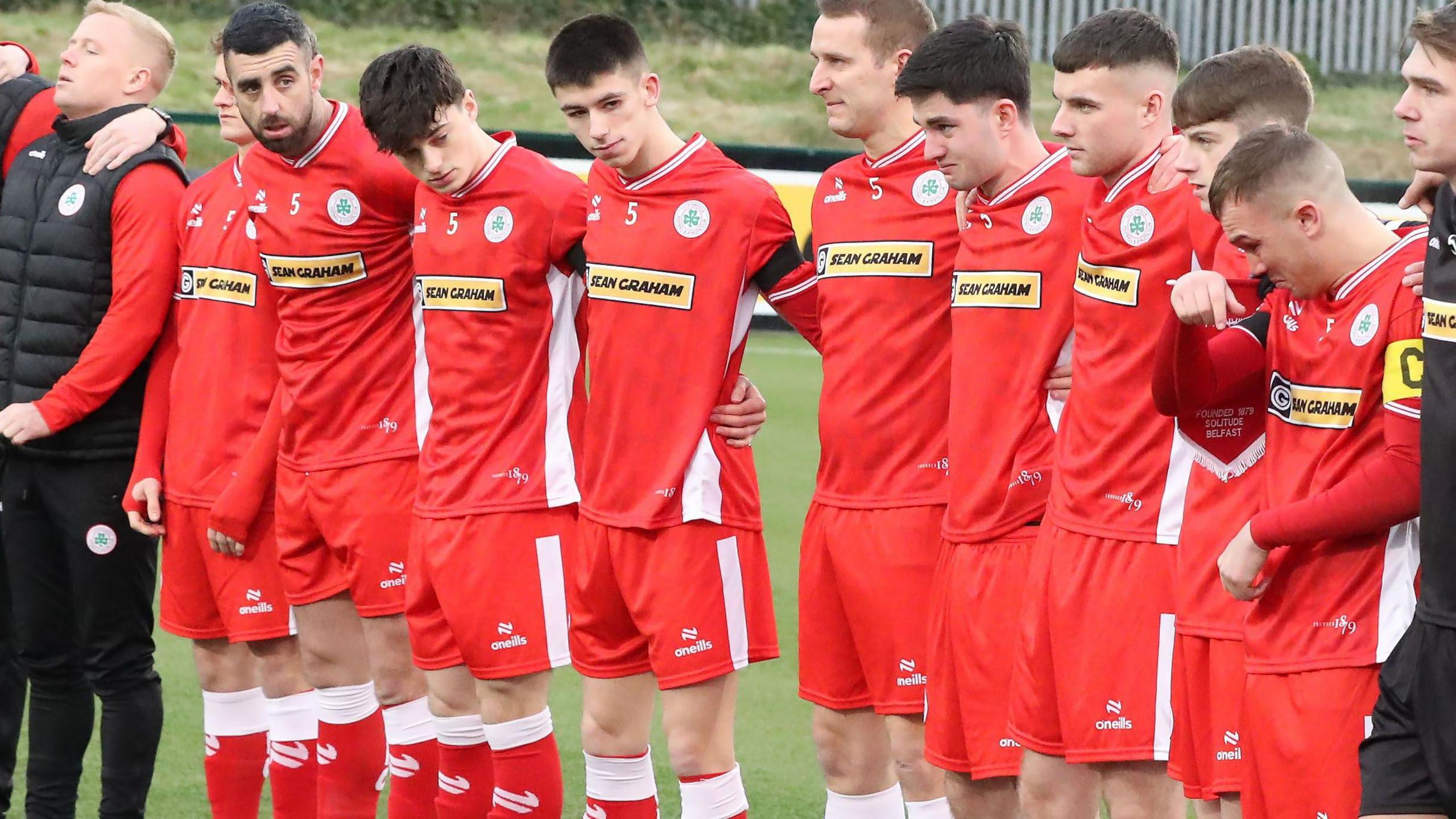 Cliftonville players line up to remember their late team-mate Michael Newberry before their Irish Cup game against Banbridge Rangers on 4 January